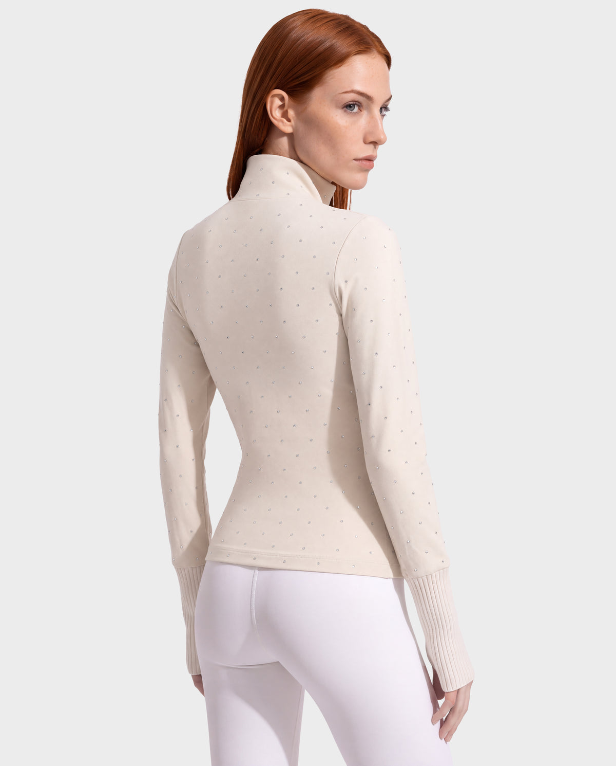 Cream-colored Rudsak NEVA - 8526524 Vanilla long-sleeve mock-neck après-ski top featuring scattered rhinestones and ribbed cuffs.