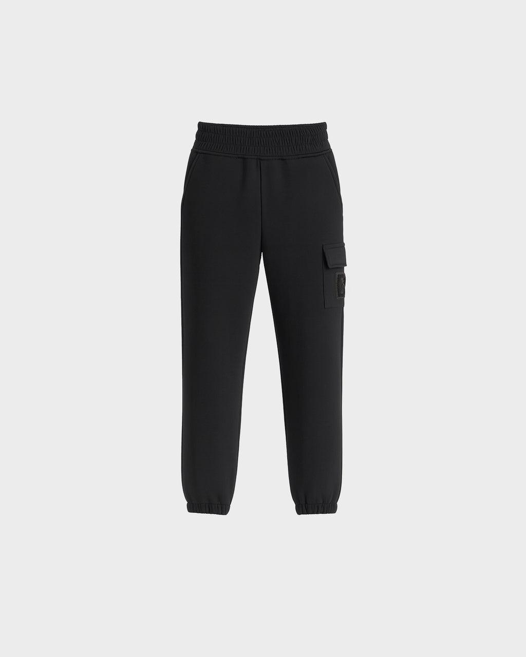 The Rudsak NOOR - 1525004 Black cargo jogger pants feature an elastic waistband, ankle cuffs, side pockets, and a buttoned flap pocket on one leg, shown against a plain white background.