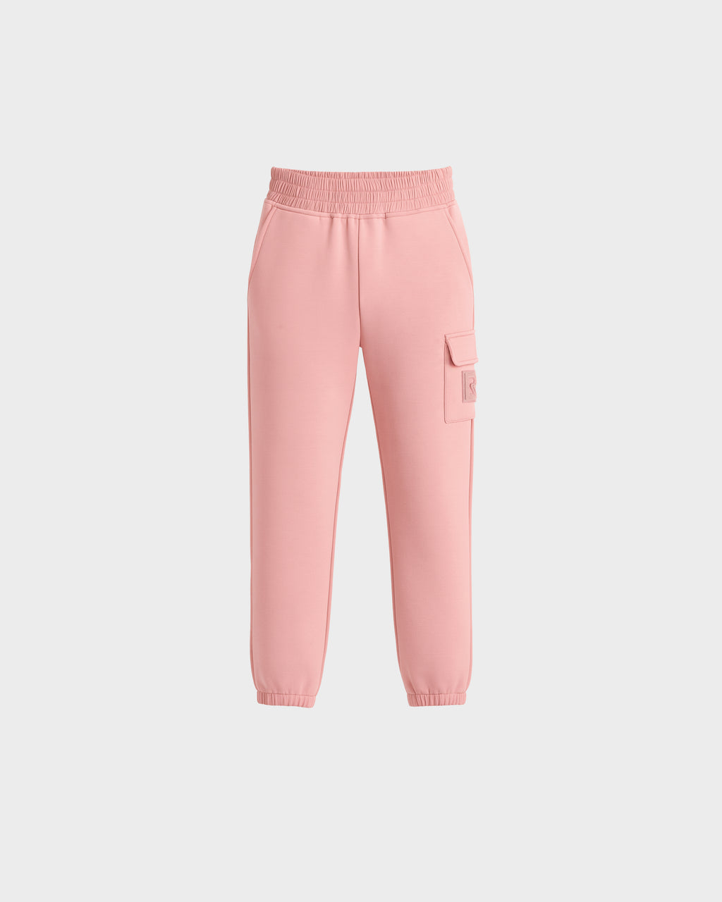 The NOOR - 1525004 Light Pink jogger pants by Rudsak feature an elastic waistband, side pockets, a right-leg cargo pocket, and elastic ankle cuffs. Shown on a plain white background.