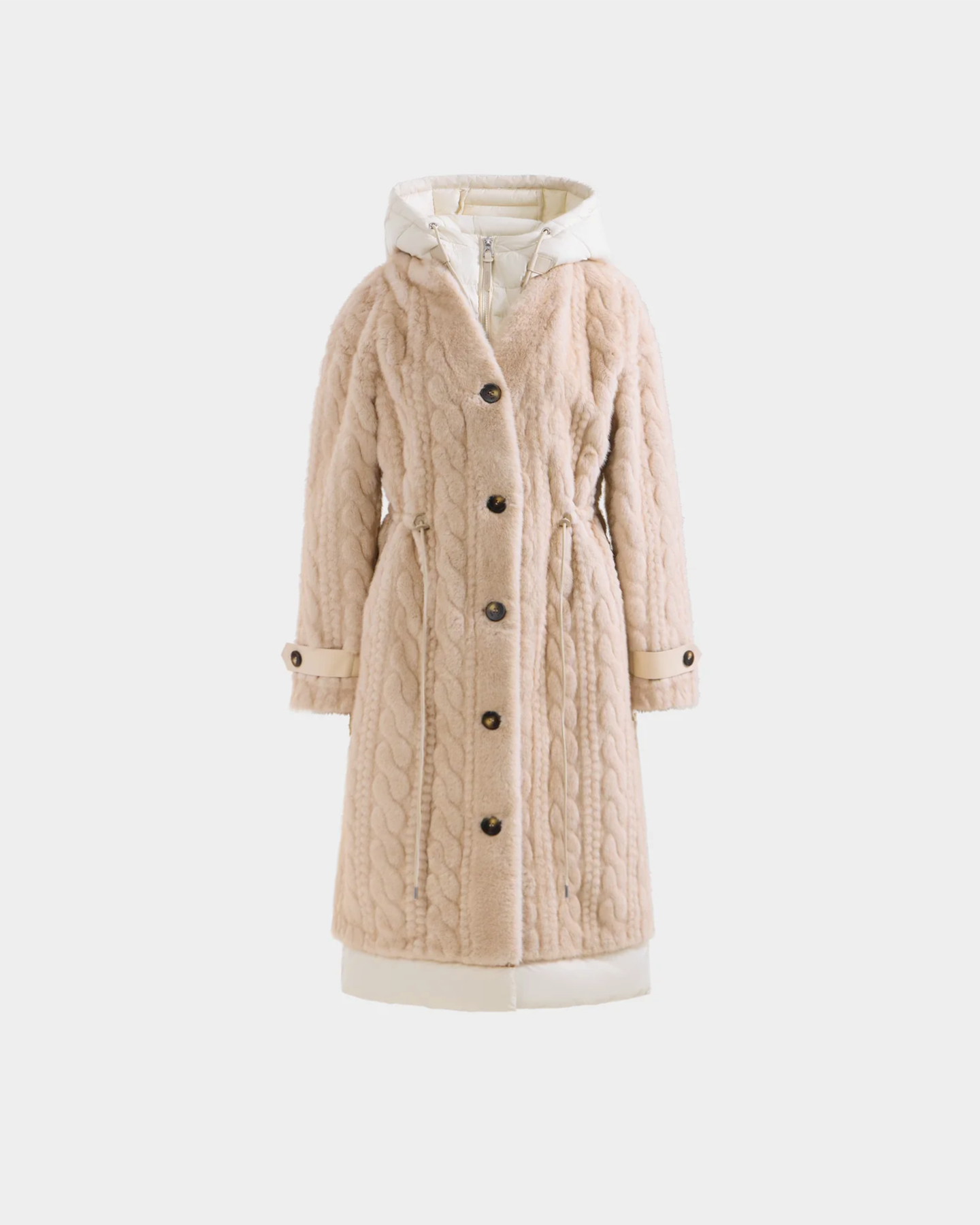 The ORIANA - 8125545 Vanilla by Rudsak is a long, beige cable-knit hooded coat with button front, waist drawstring, cuffed sleeves, and elegant vegan leather trim, shown on a plain white background.