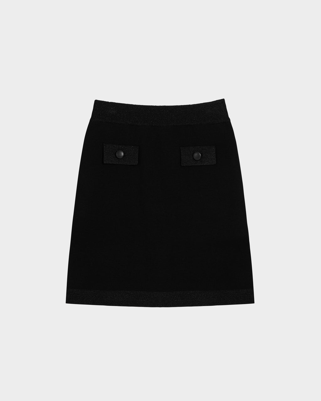 The PANAMA - 8525075 Black women’s knit mini skirt by Rudsak features a straight cut, textured waistband and hem, and two front pockets with black button accents, shown on a plain light grey background.