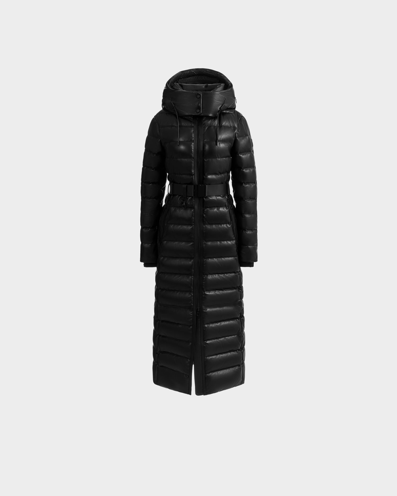 The Rudsak PELIN LX - 8125692 Black is a women's long black puffer maxi coat with a hood, high collar, and belted waist, displayed on a plain light gray background.
