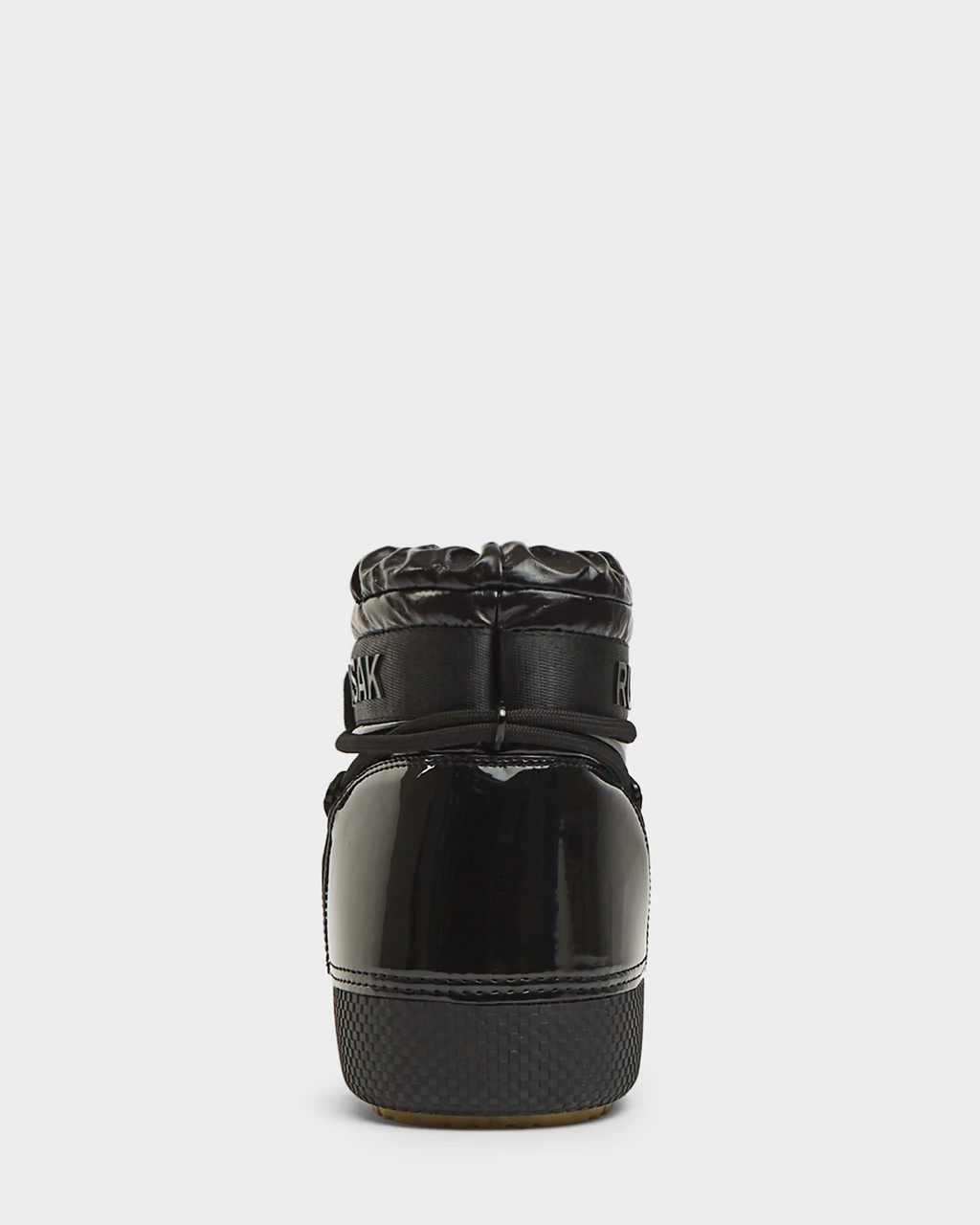 The Rudsak MACE - 8223500 Black women's short moon boot is shown from the back, with glossy water-repellent material, a thick sole, and a padded quilted collar featuring partially visible text near the top.