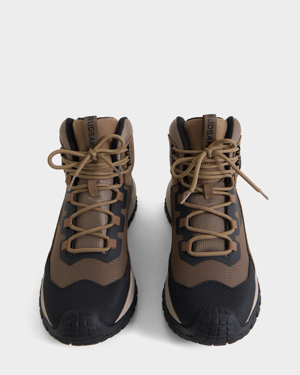 A pair of Rudsak REXON - 6226503 Cement hiking boots in brown and black with laces, featuring a winter-ready boot style, viewed from above on a plain white background.