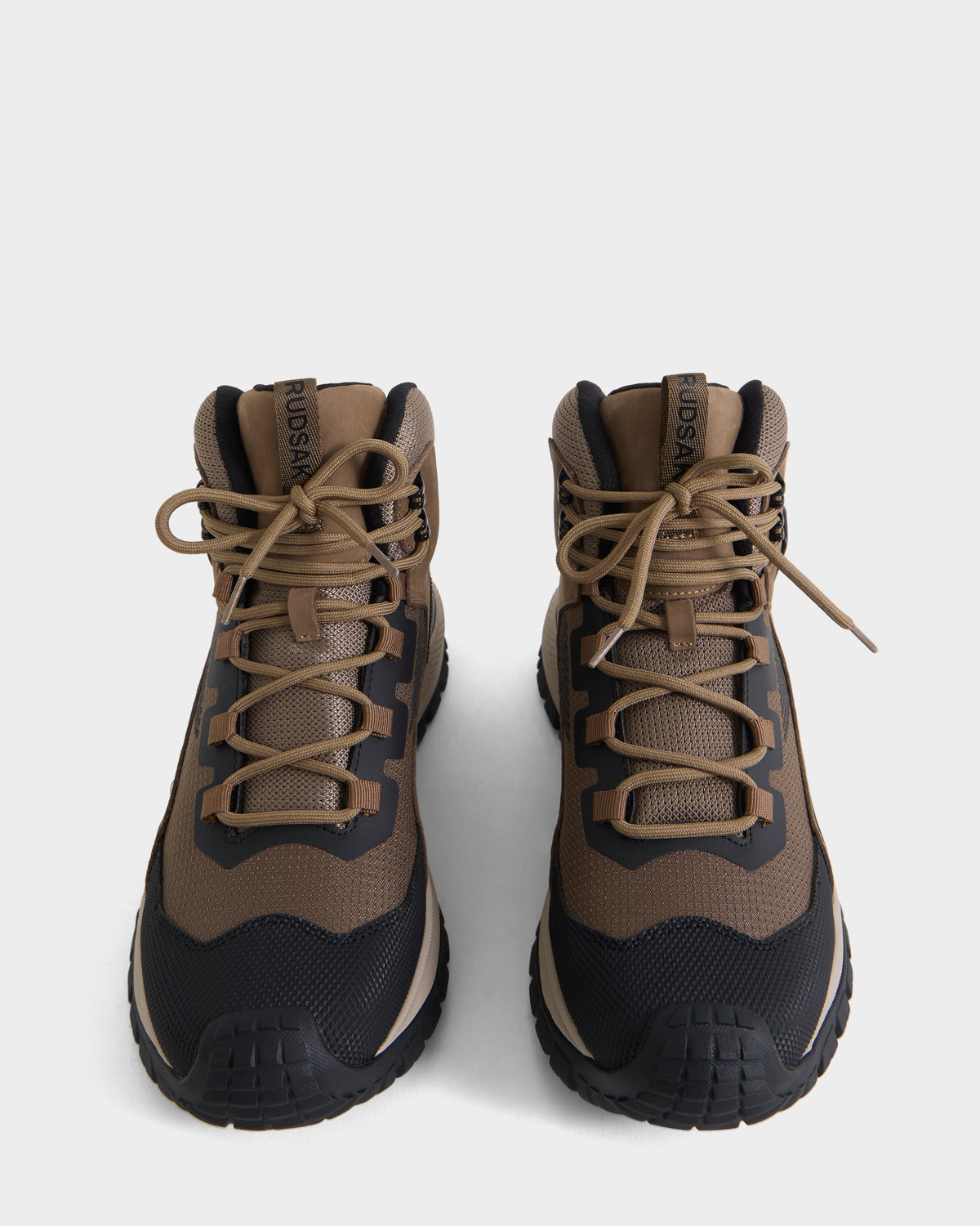 A pair of Rudsak REXON - 6226503 Cement hiking boots in brown and black with laces, featuring a winter-ready boot style, viewed from above on a plain white background.