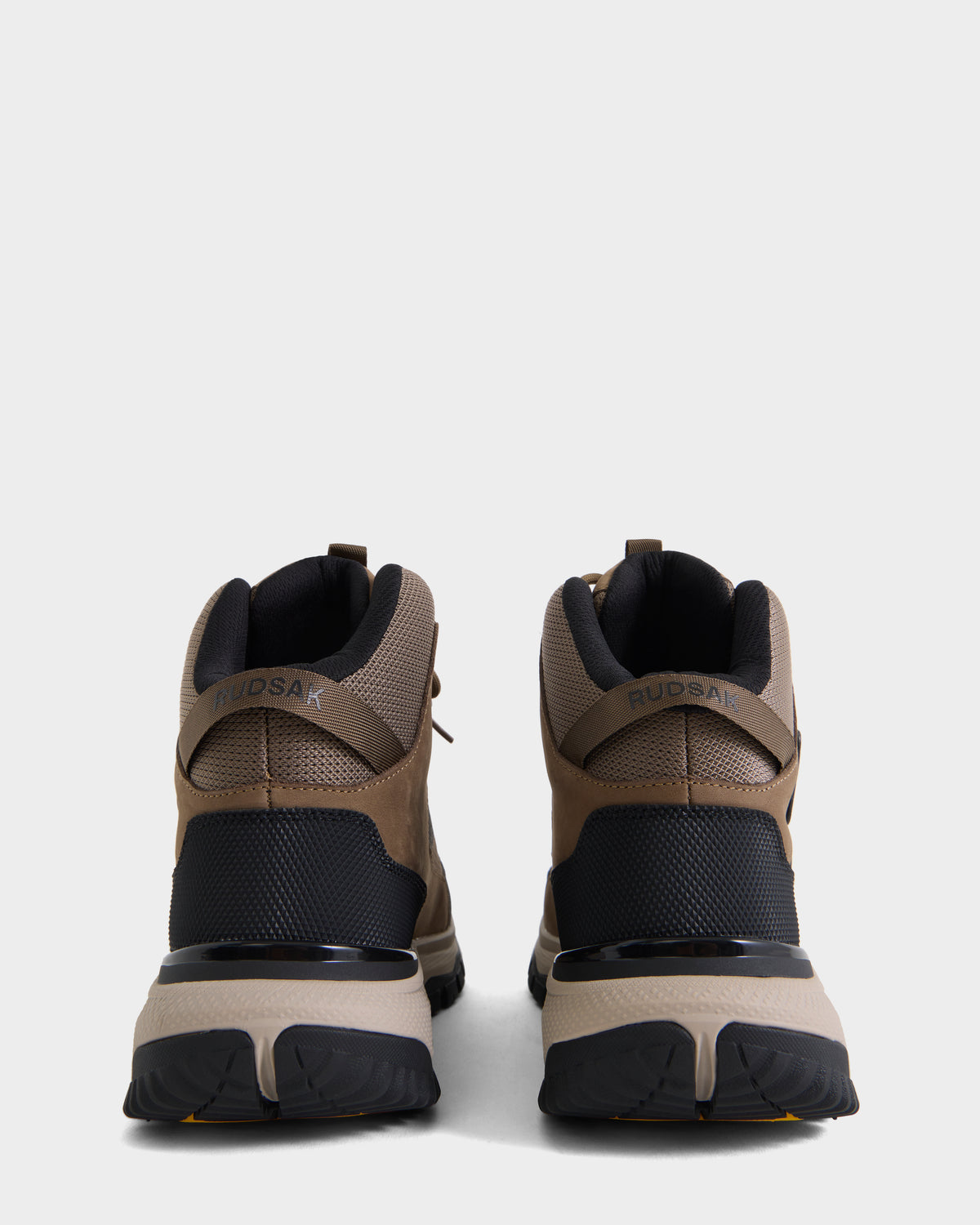 Rear view of a pair of REXON - 6226503 Cement high-top sneakers by Rudsak, featuring brown and black color blocking, textured soles, mesh panels, and padded collars, set against a plain white background.