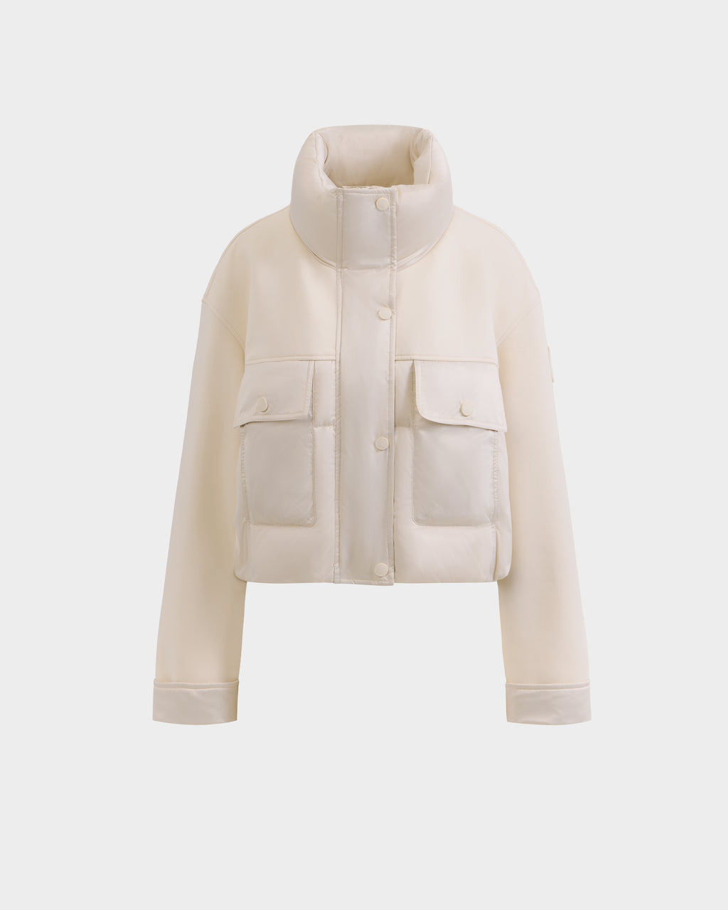 The Rudsak ROME - 8126028 Iceland is an off-white, cropped, quilted down-filled spring jacket with a high collar, snap button closures, and two large front pockets, shown against a plain white background.