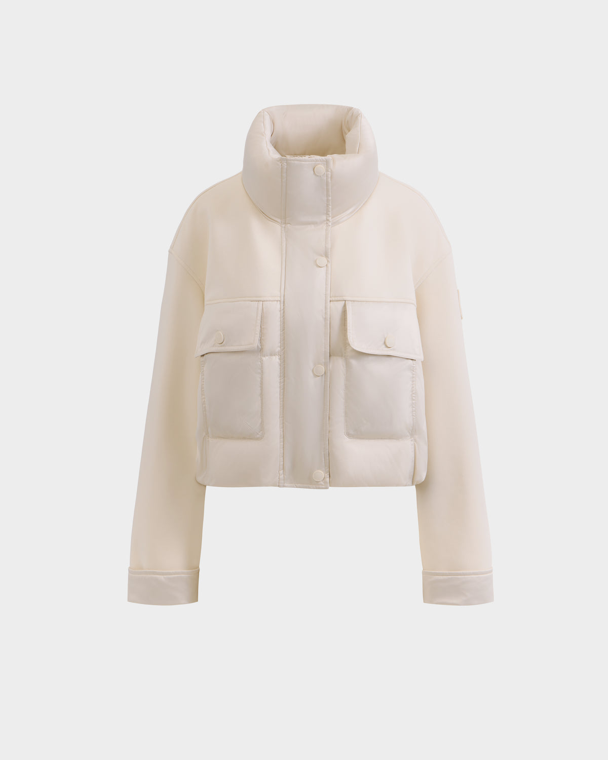 The Rudsak ROME - 8126028 Iceland is an off-white, cropped, quilted down-filled spring jacket with a high collar, snap button closures, and two large front pockets, shown against a plain white background.