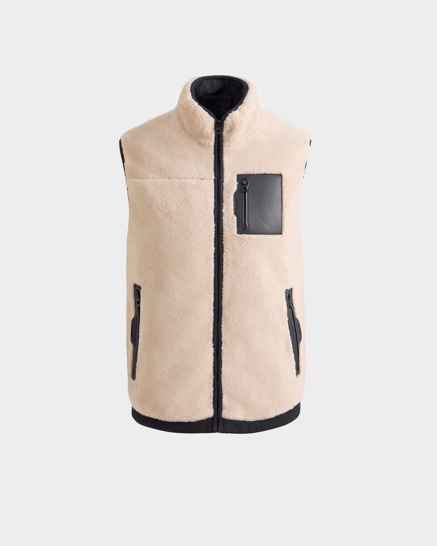 Rudsak RUMMY - U524502 Vanilla M unisex beige polar fleece vest with front zipper, two zippered side pockets, one black zippered chest pocket, and black trim, shown on a light gray background.