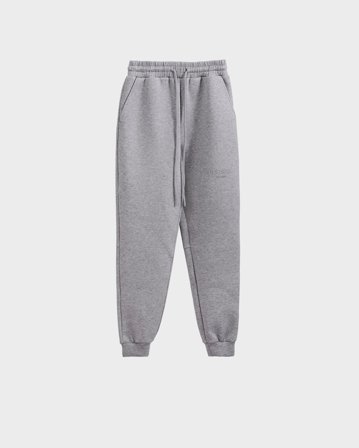 The Rudsak JOSS - 9524009 joggers in heather grey (M) feature premium cotton, an elastic waistband with drawstring, side pockets, and cuffed ankles, shown on a plain white background.