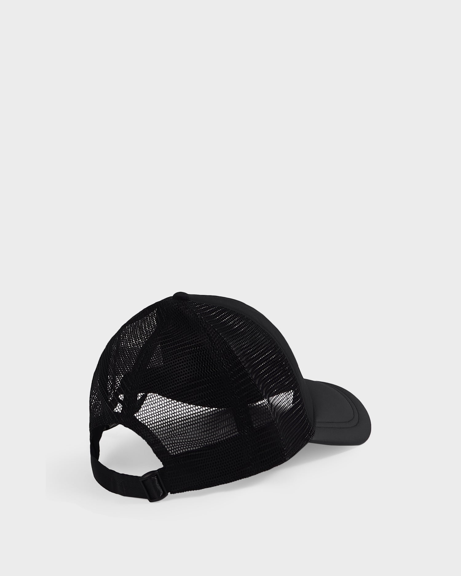 The Rudsak FENIX - 9422522 Black trucker hat features a black mesh back and an adjustable strap, shown from the back and slightly to the side against a plain light grey background.