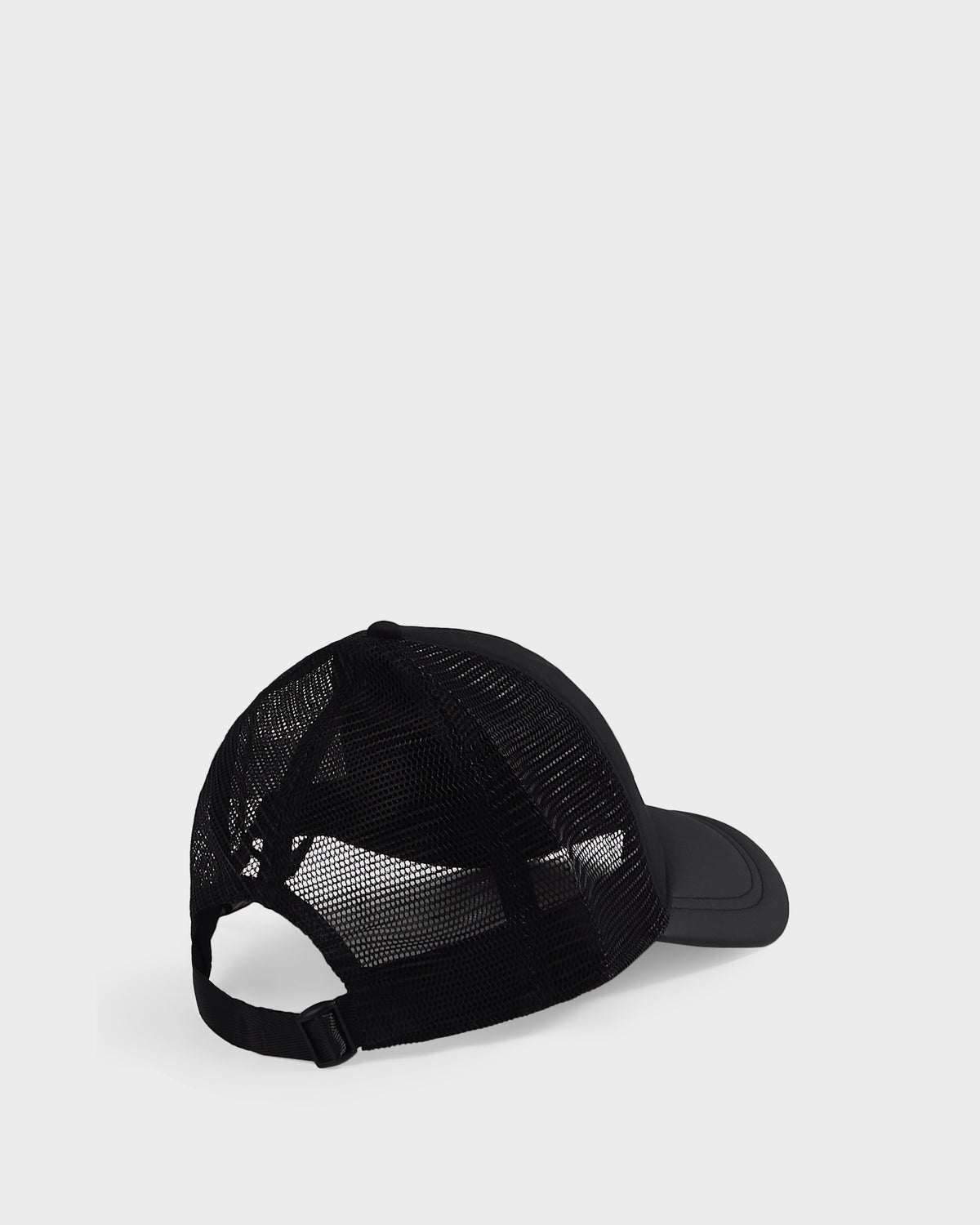 The Rudsak FENIX - 9422522 Black trucker hat features a black mesh back and an adjustable strap, shown from the back and slightly to the side against a plain light grey background.