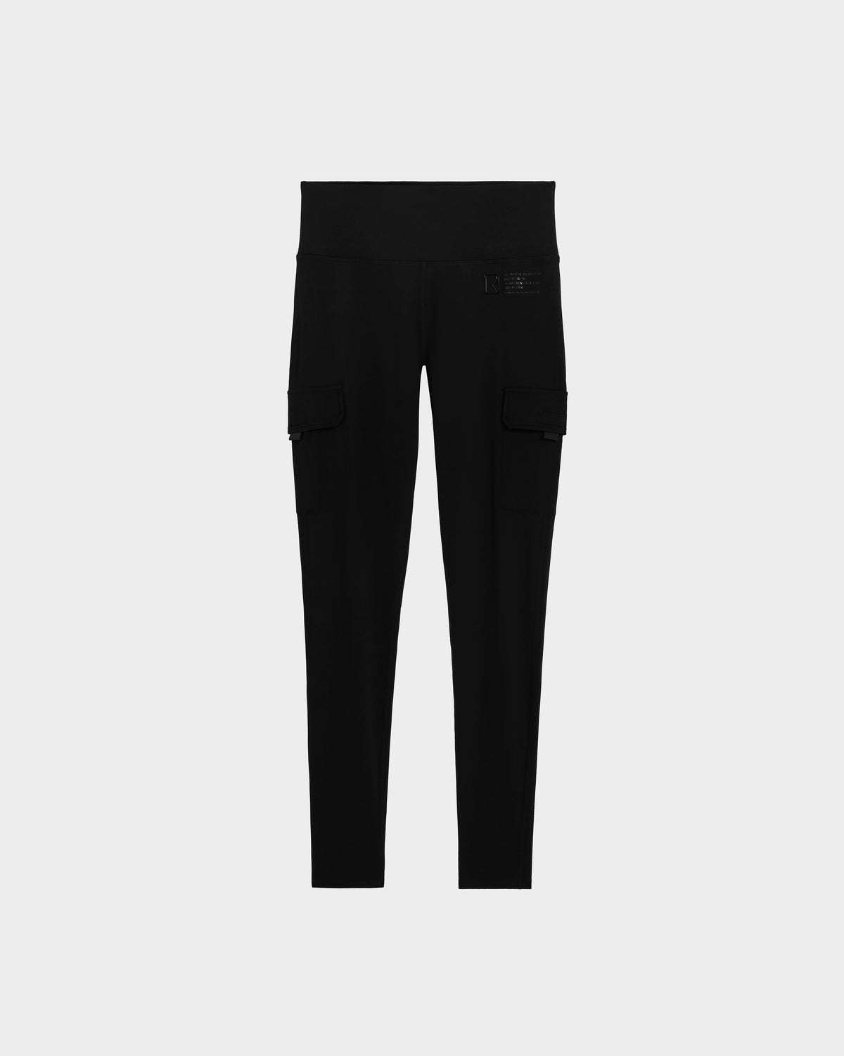 The SIEN - 8525090 Black cargo leggings by Rudsak feature a high waist, stretch fabric, and side flap pockets—an activewear essential. Shown on a plain light grey background.