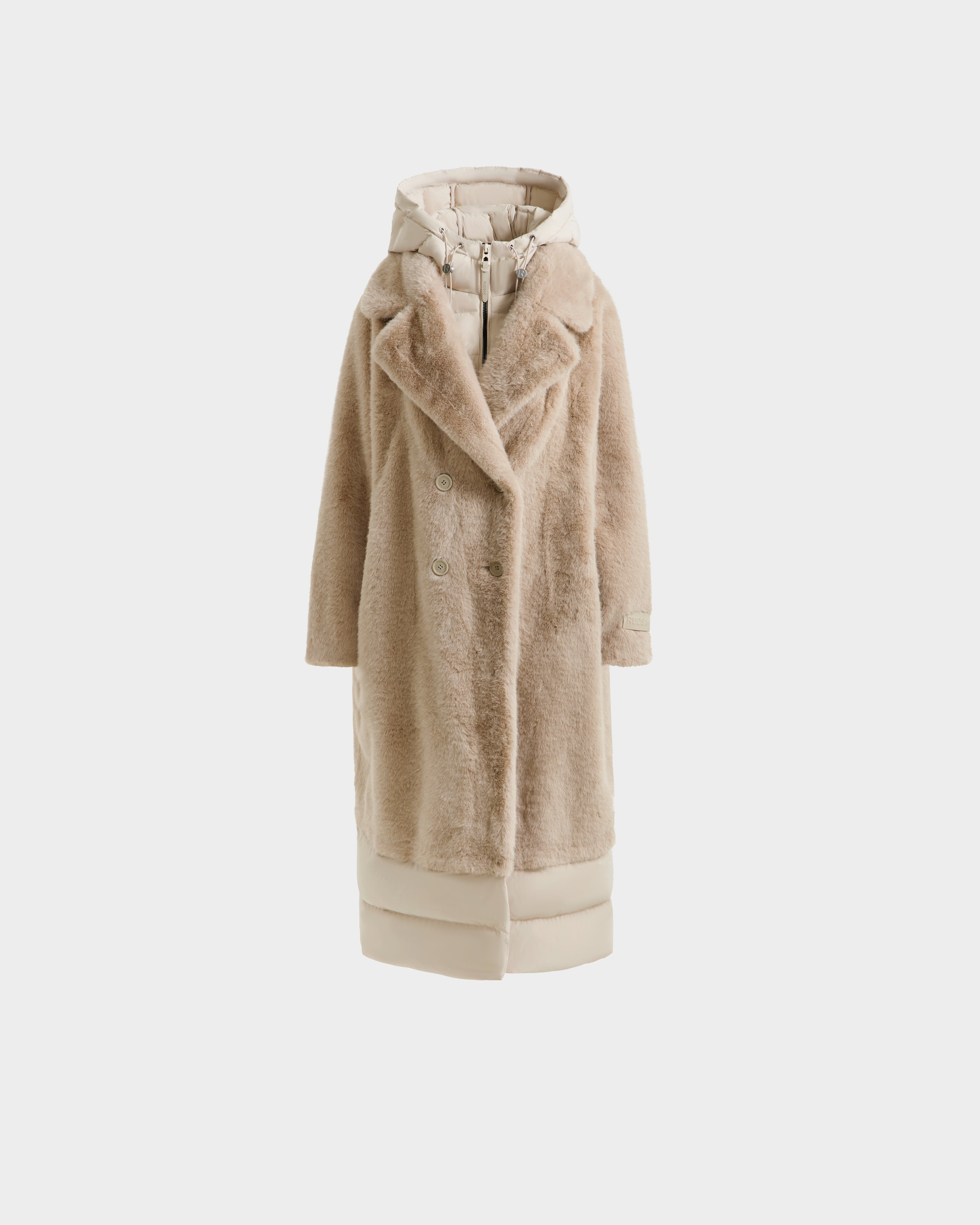 The Rudsak SIENA - 8125542 Vanilla is a long beige women's faux fur coat featuring a double-breasted front, wide lapels, hood, and down-insulated hem and hood accents—ideal for chic winter style. Displayed on a plain white background.