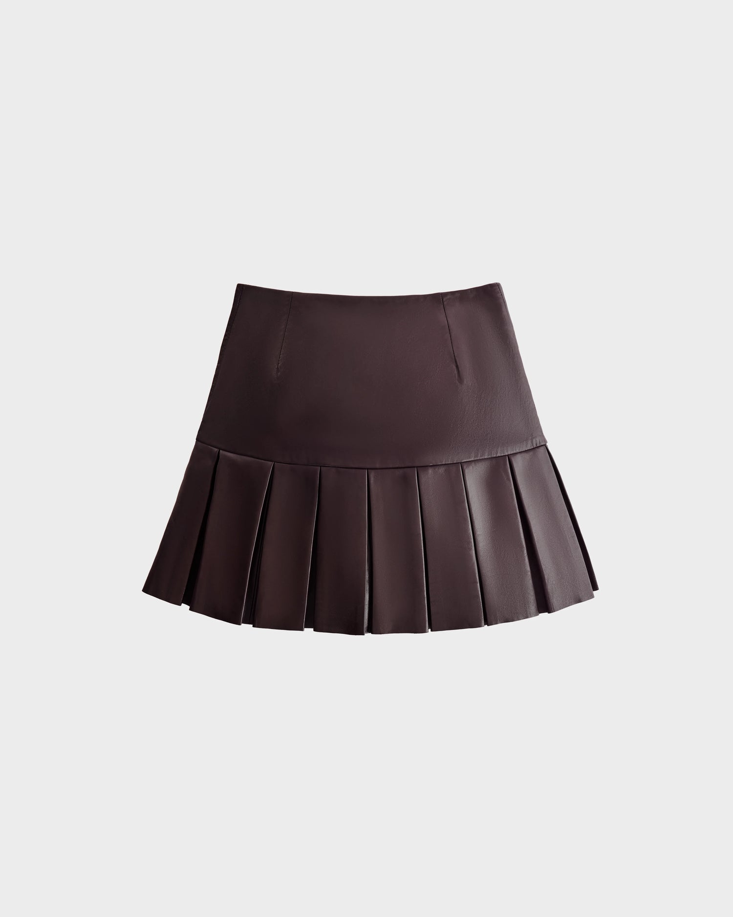 The Rudsak SOLANGE - 8524543 Bordeaux is a chic women's mini skirt in dark brown leather with sharp pleats and a luxe finish, shown against a plain light gray background.