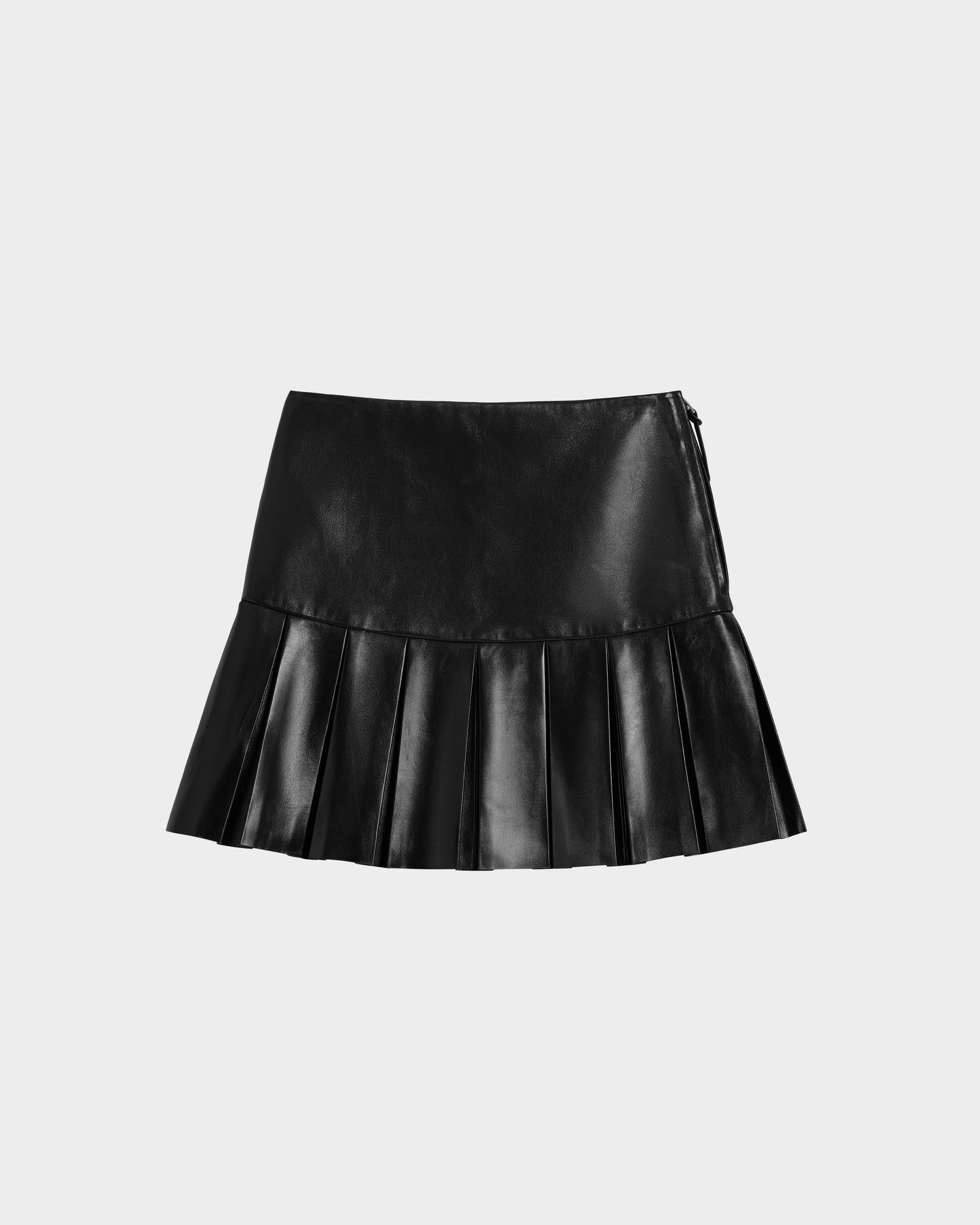 The Rudsak SOLANGE - 8525013 Black womens leather skirt features a fitted top and wide knife pleats at the hem, shown against a plain white background.