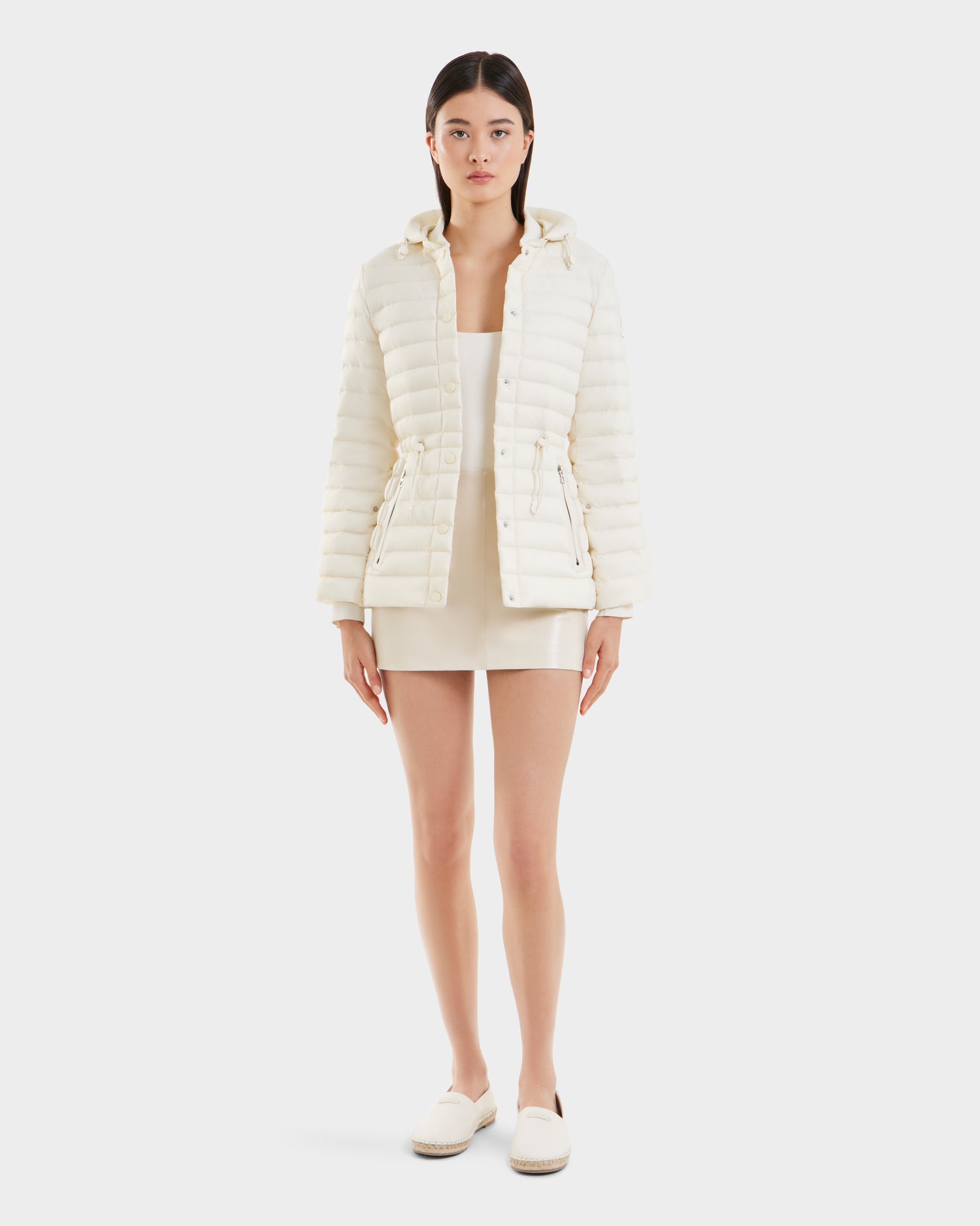 A woman in the AMAYAH - L125015 Iceland dress by Rudsak showcases a graceful feminine silhouette.