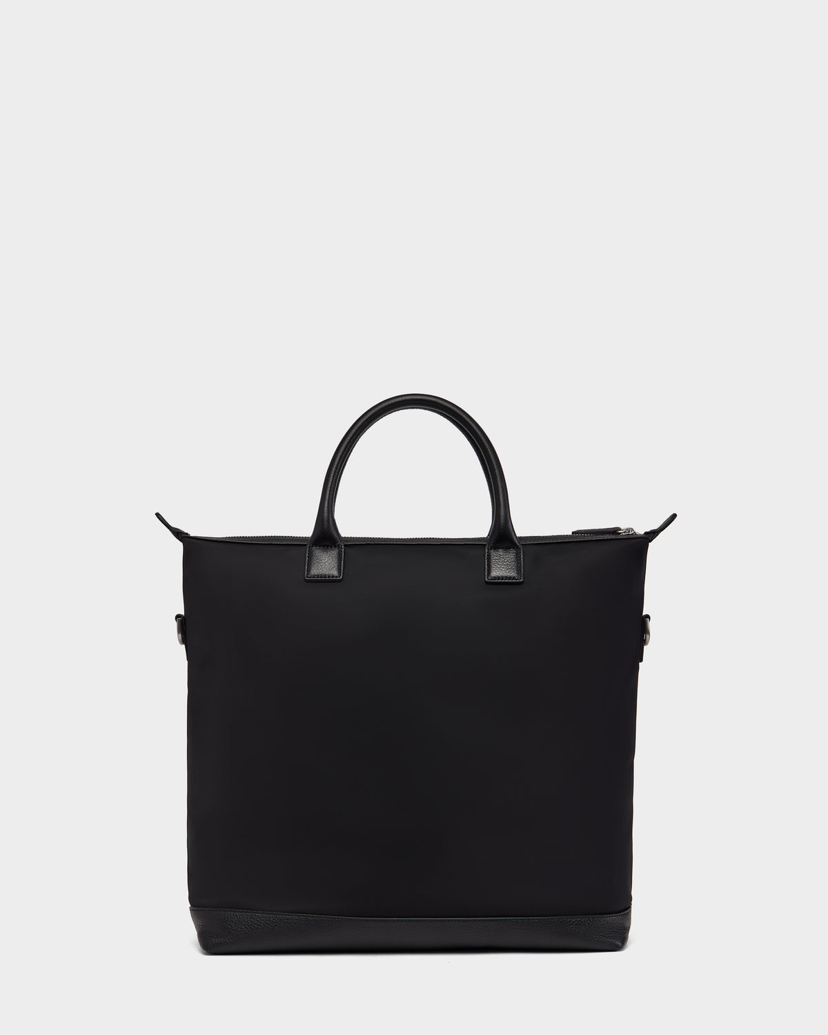 The DEXTER - 9324513 Black by Rudsak is a black canvas tote with two short handles and a zippered top, shown on a white background—a versatile accessory for any outing.
