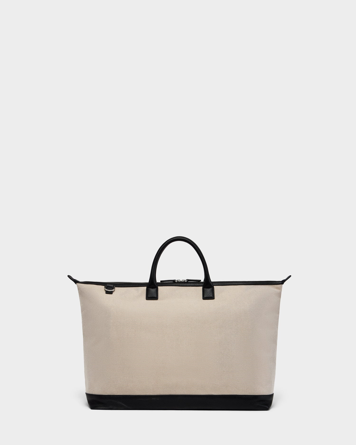 The Rudsak DUBLIN - 9324514 Vanilla is a beige canvas leather unisex tote with black handles, zipper, and base trim, ideal as a weekender bag. Displayed on a plain light gray background.