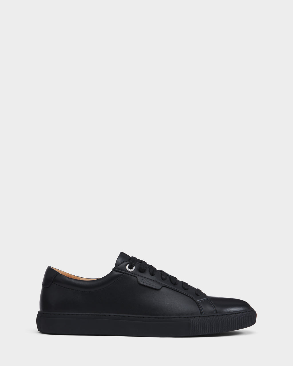 The LARIS - 6225000 Black by Rudsak is a black low-top lace-up sneaker with black laces, a black sole, and minimal stitching, shown in side profile against a plain white background.