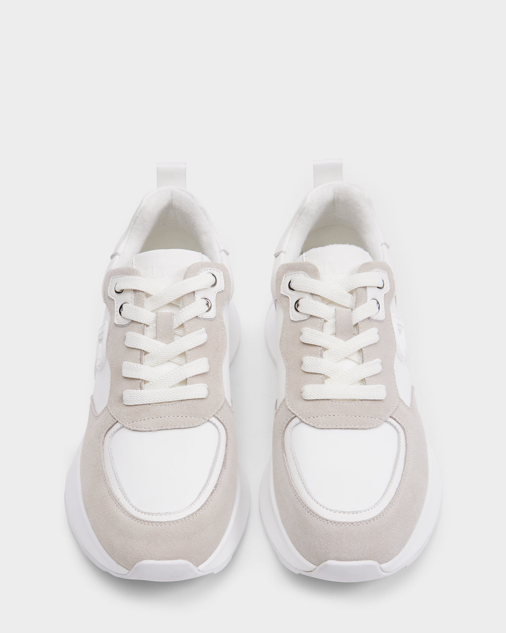 The Rudsak LIONEL - 6225001 Iceland men’s sneakers feature a modern white and light beige lace-up design, shown from above on a plain white background.
