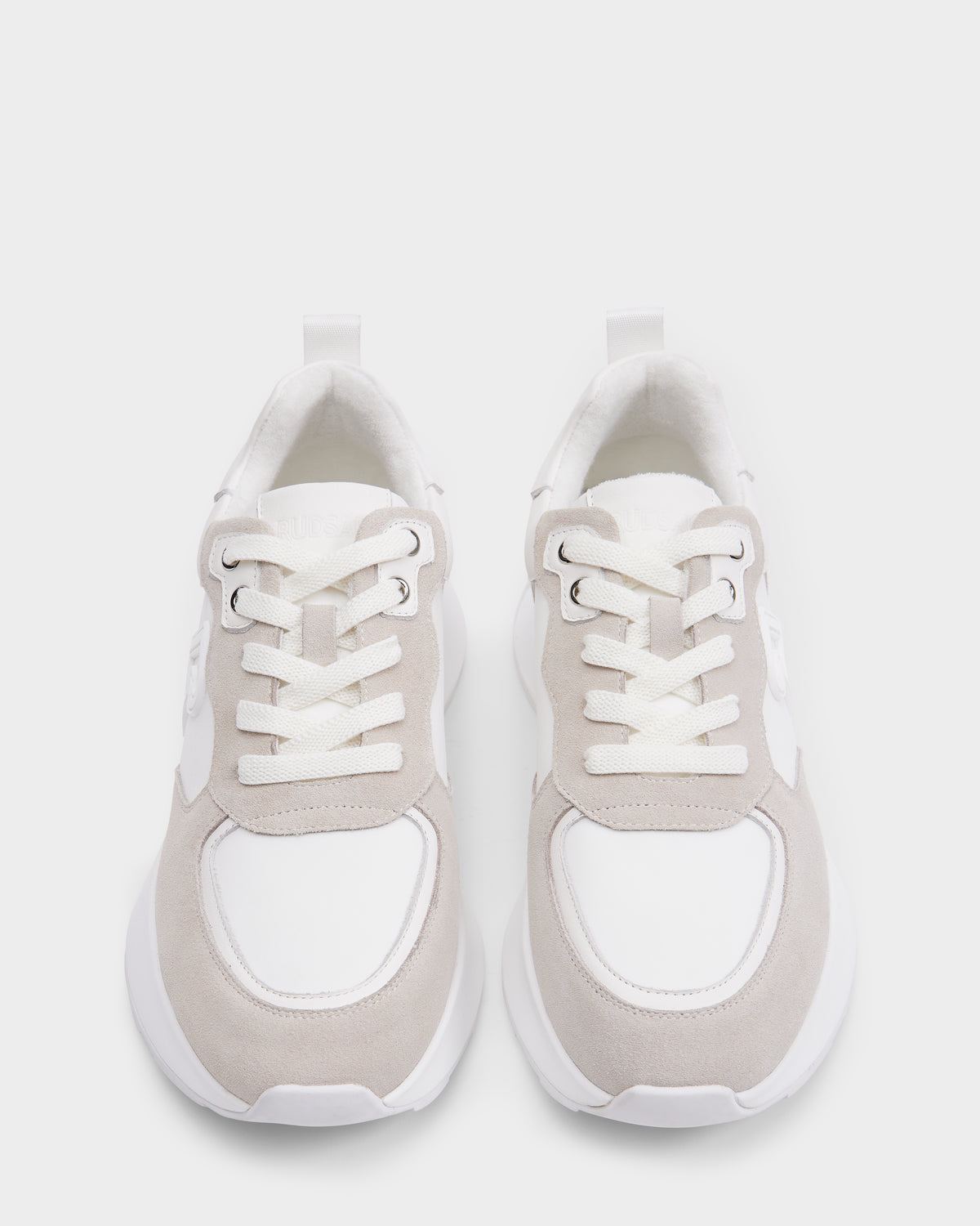 The Rudsak LIONEL - 6225001 Iceland men’s sneakers feature a modern white and light beige lace-up design, shown from above on a plain white background.