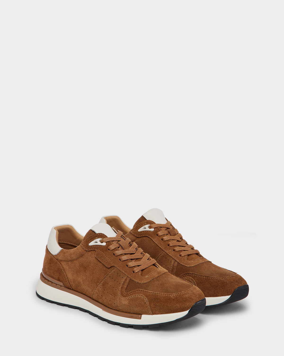 The Rudsak MALONE S - 6225002 Almond mens suede sneakers feature a brown upper with white heel and tongue accents, tan laces, white midsoles, and black rubber outsoles—versatile everyday footwear shown on a plain white background.