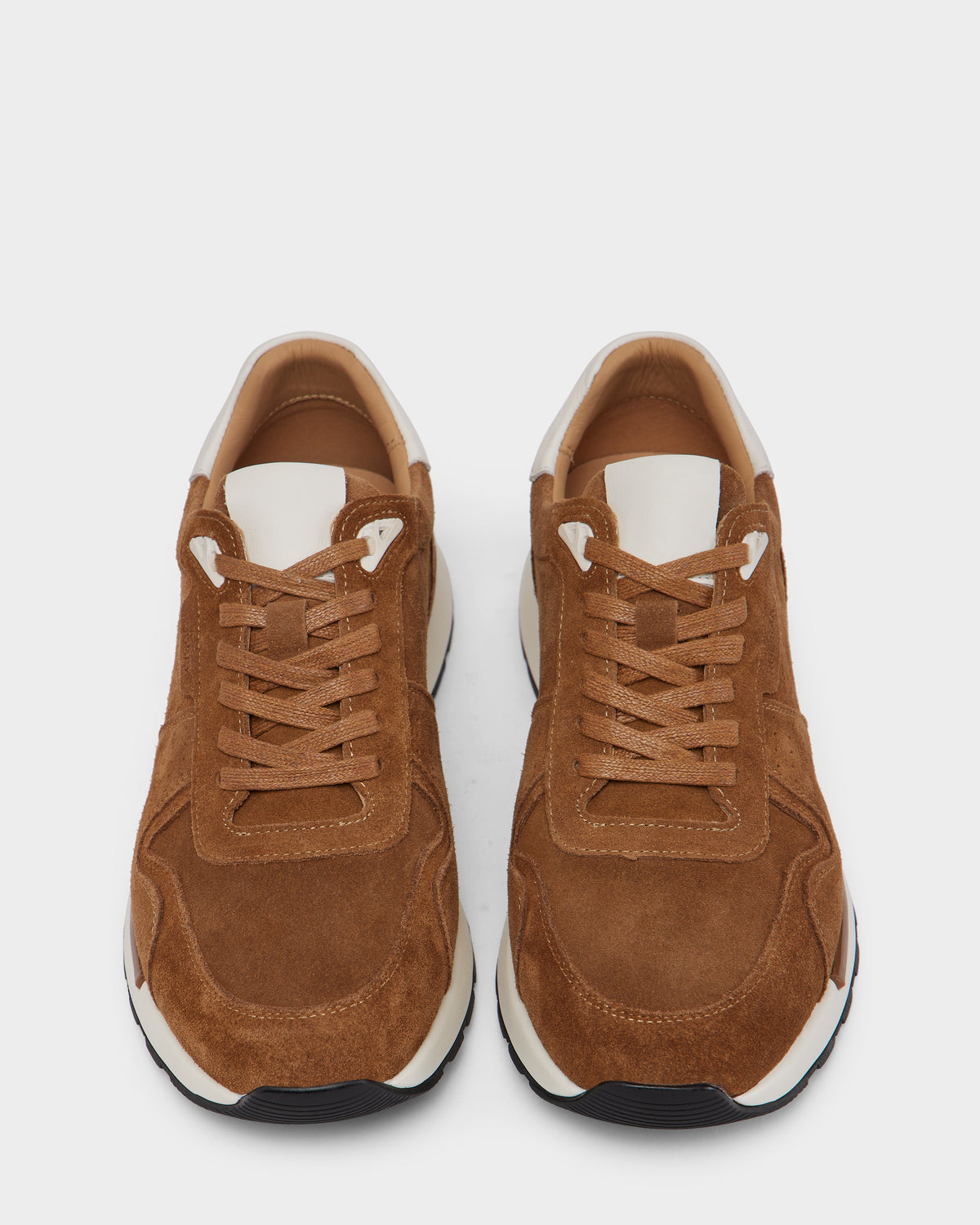 A pair of Rudsak MALONE S - 6225002 Almond men’s brown suede sneakers with white accents and beige inner lining, featuring modern design elements, displayed side by side on a white background, toe caps facing forward.