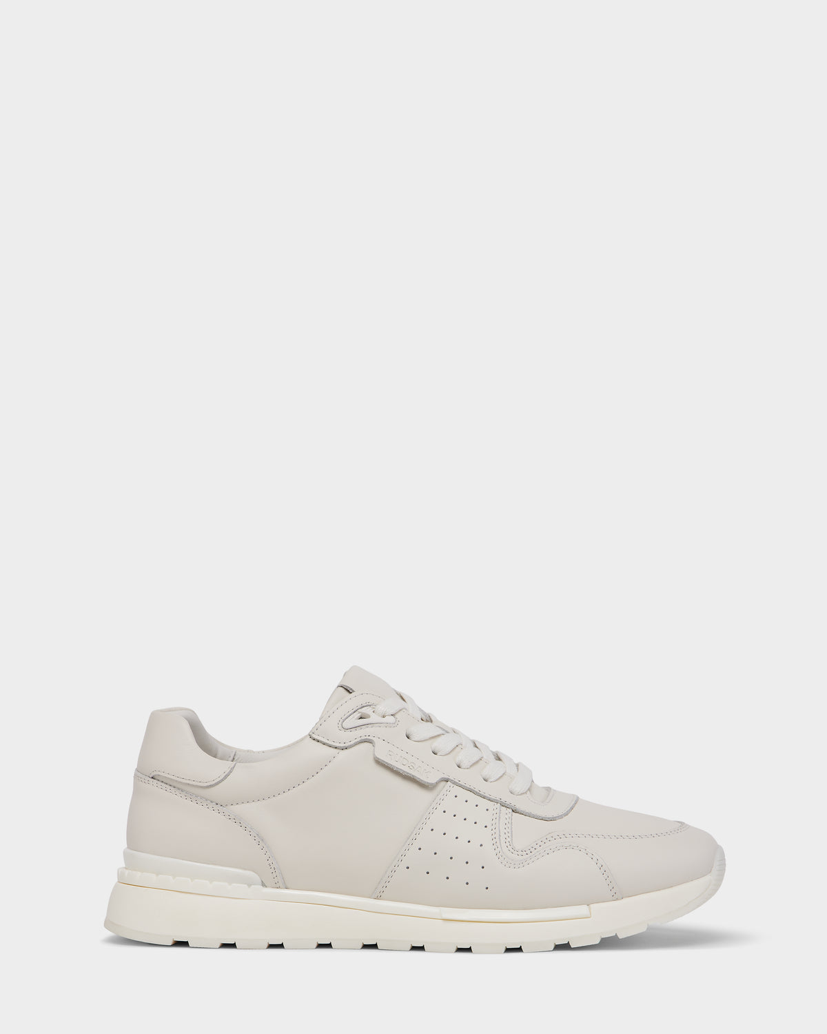 The MALONE - 6225010 Iceland by Rudsak is a men’s beige leather sneaker with white laces, perforated sides, and a white rubber sole—crafted from premium materials and ideal for everyday wear, shown on a plain white background.