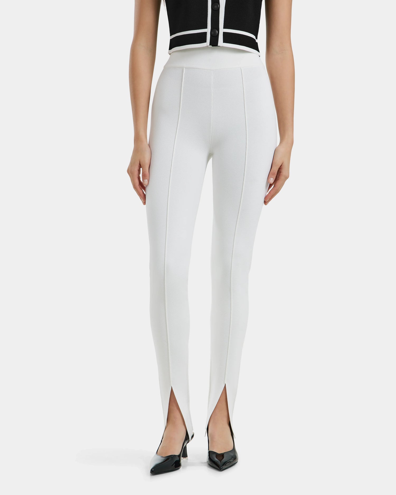 A woman wearing white ankle slit leggings from Rudsak, product MATHILDA - 8524515 Iceland.