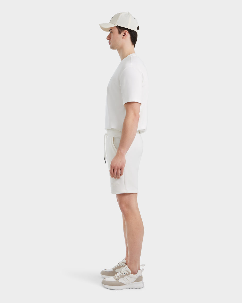 A man in white Rudsak PASCAL - 6524022 ICELAND shorts and a white shirt.