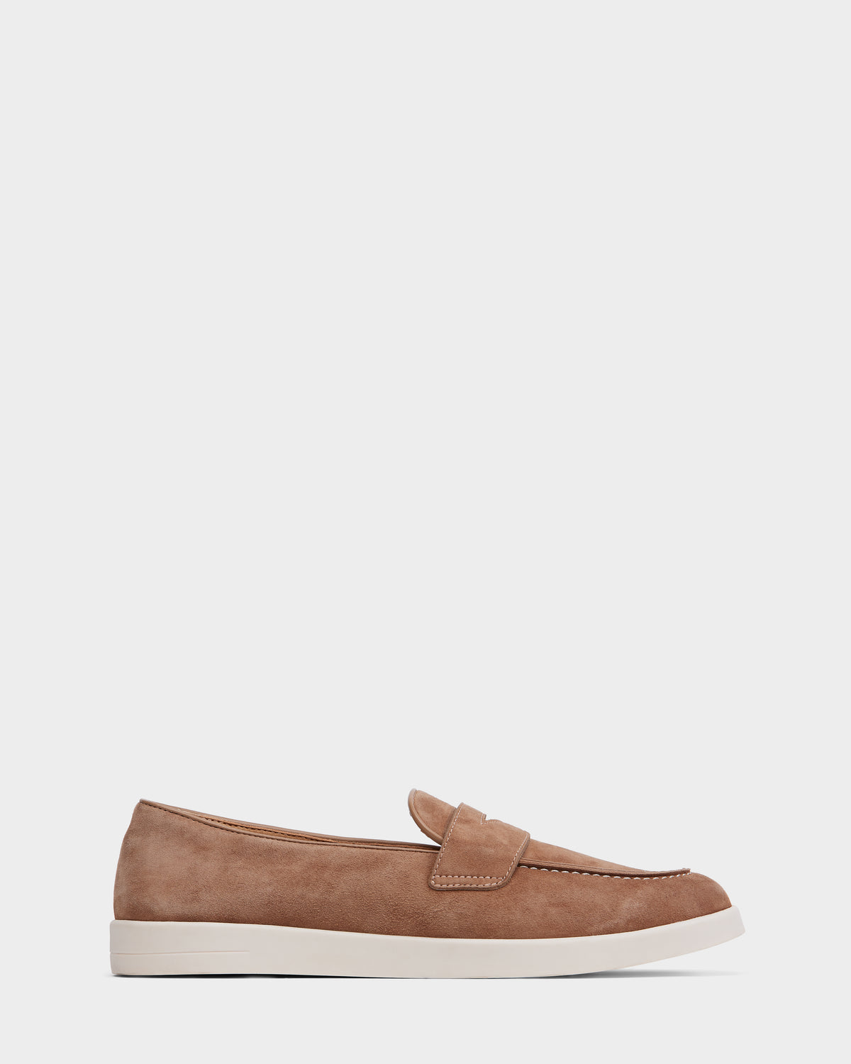 The RABECCA - 8225006 Almond by Rudsak is a womens tan suede slip-on loafer with visible stitching, a white rubber sole, and a low profile—ideal for those seeking luxury shoes.