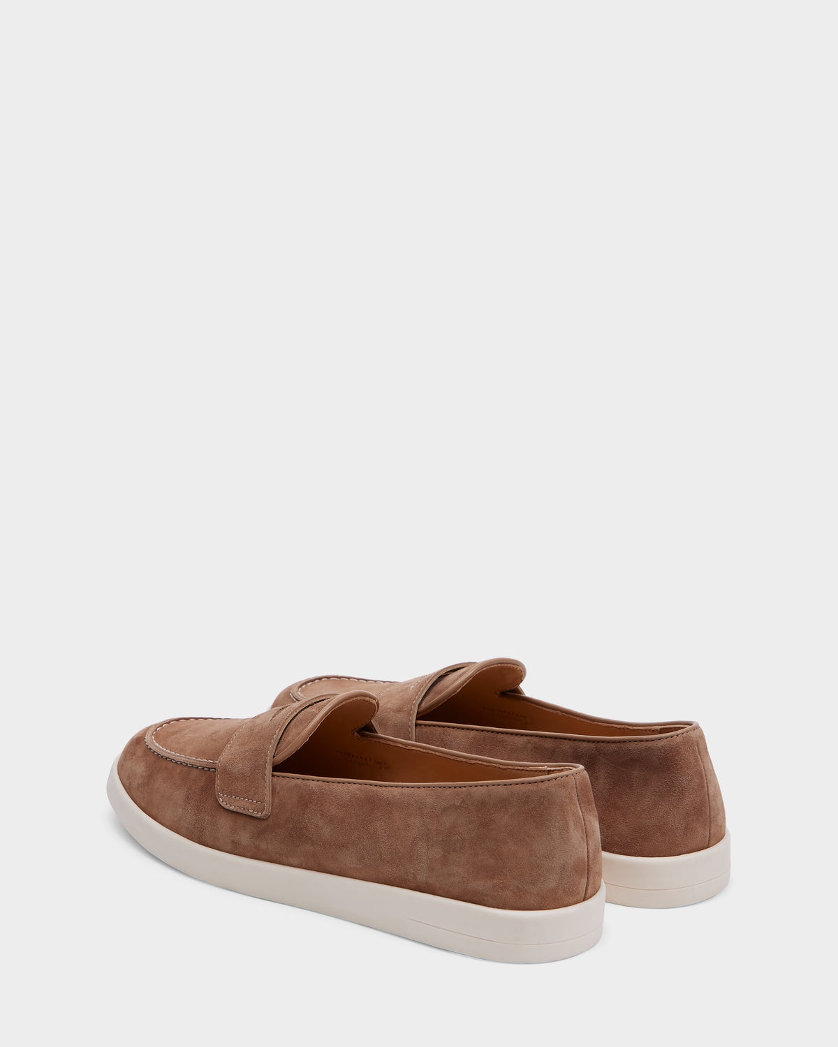 The Rudsak RABECCA - 8225006 Almond womens brown suede loafers feature white rubber soles and are shown from a rear three-quarter angle against a plain light background.