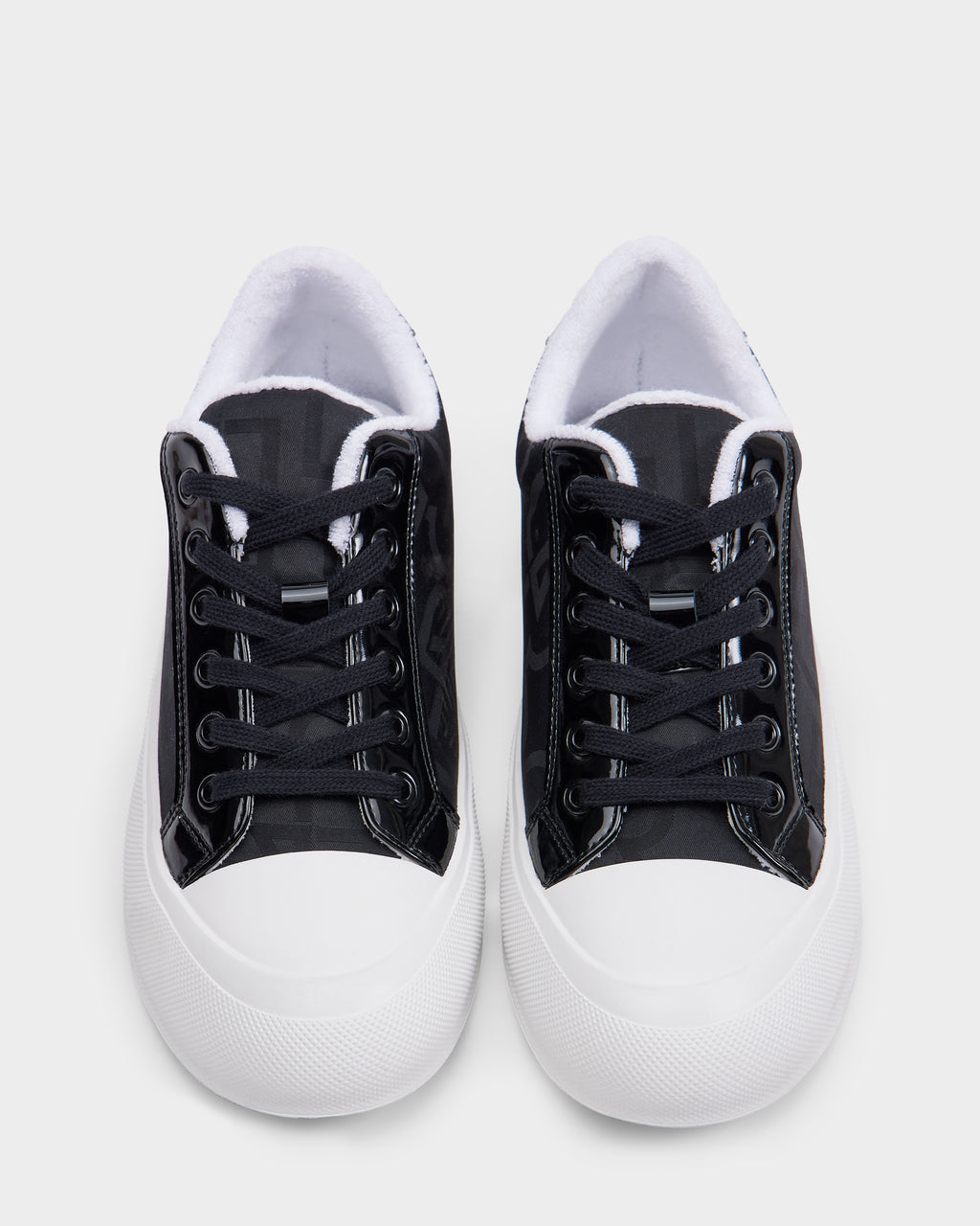 A pair of Rudsak RIMA - 8225001 Black Pattern women’s platform sneakers with white rubber soles and toe caps, shown from above on a plain white background.