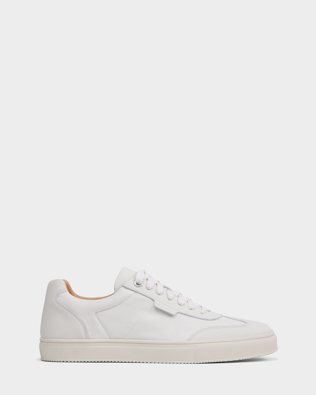 The Rudsak SKYLER - 6225003 Iceland is a minimalist white leather sneaker with white laces, a white sole, and a padded collar—shown in side profile against a light background. Ideal for those seeking comfortable, stylish footwear.