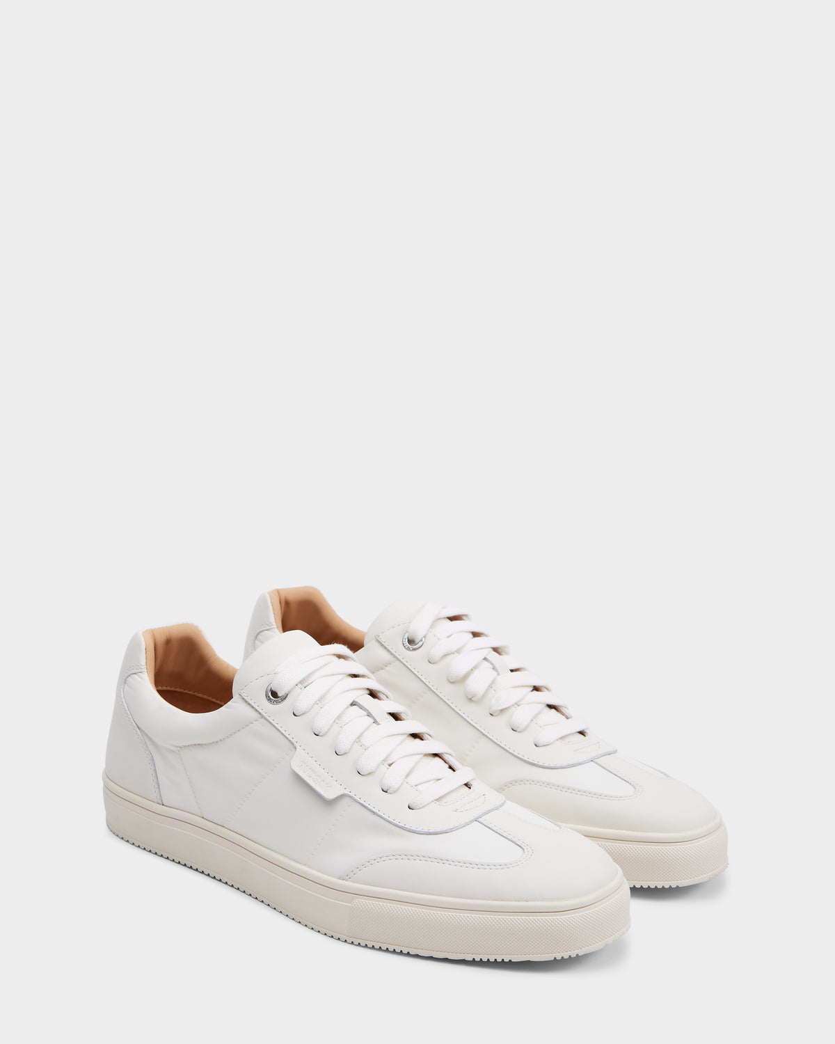 The SKYLER - 6225003 Iceland sneakers by Rudsak feature a white minimalist design with white laces and beige inner lining—ideal for anyone seeking comfortable, timeless style.