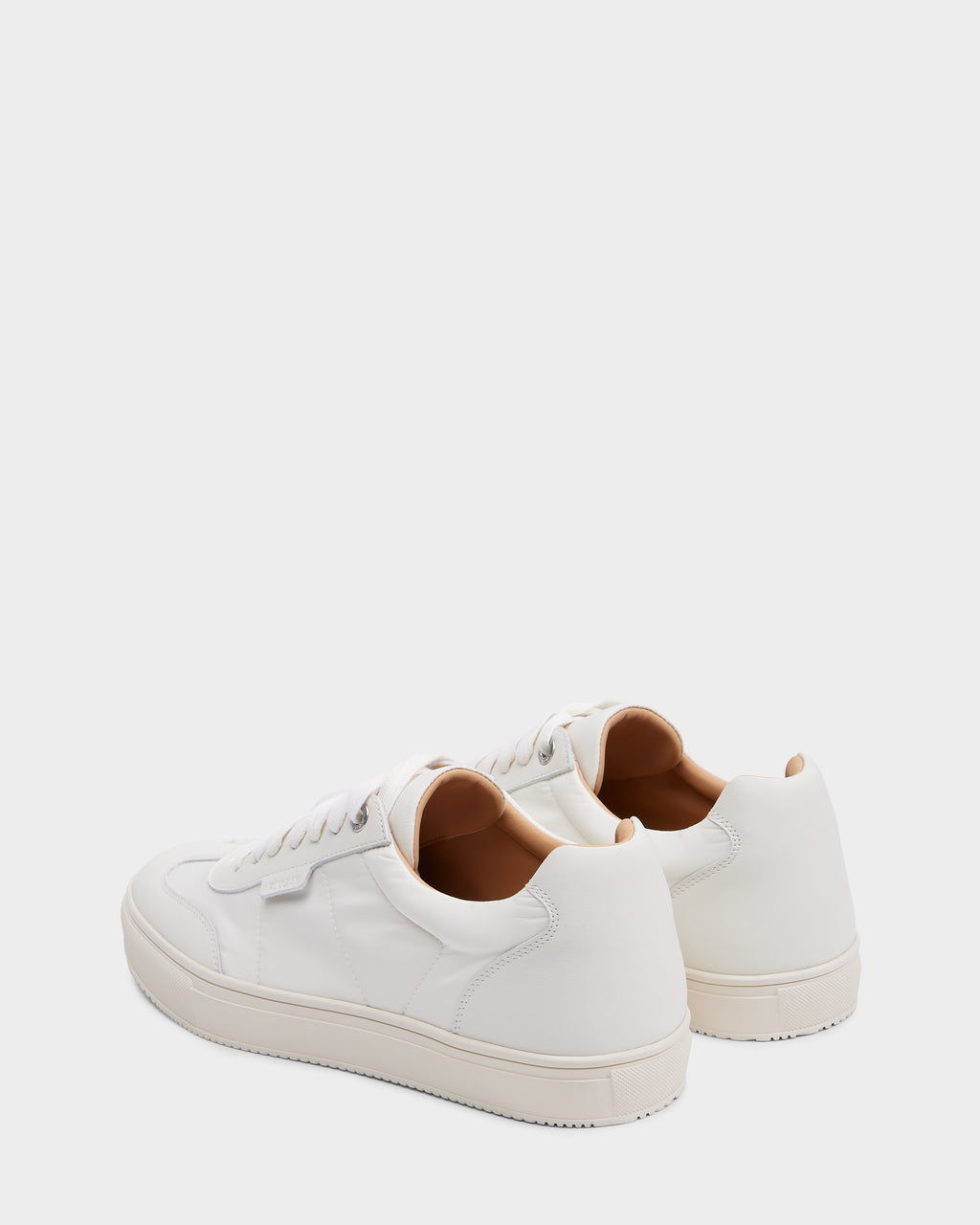 The Rudsak SKYLER - 6225003 Iceland men’s sneakers feature white leather, white laces, and beige interiors, shown from the back and side on a plain background—ideal minimalist shoes for everyday comfort.