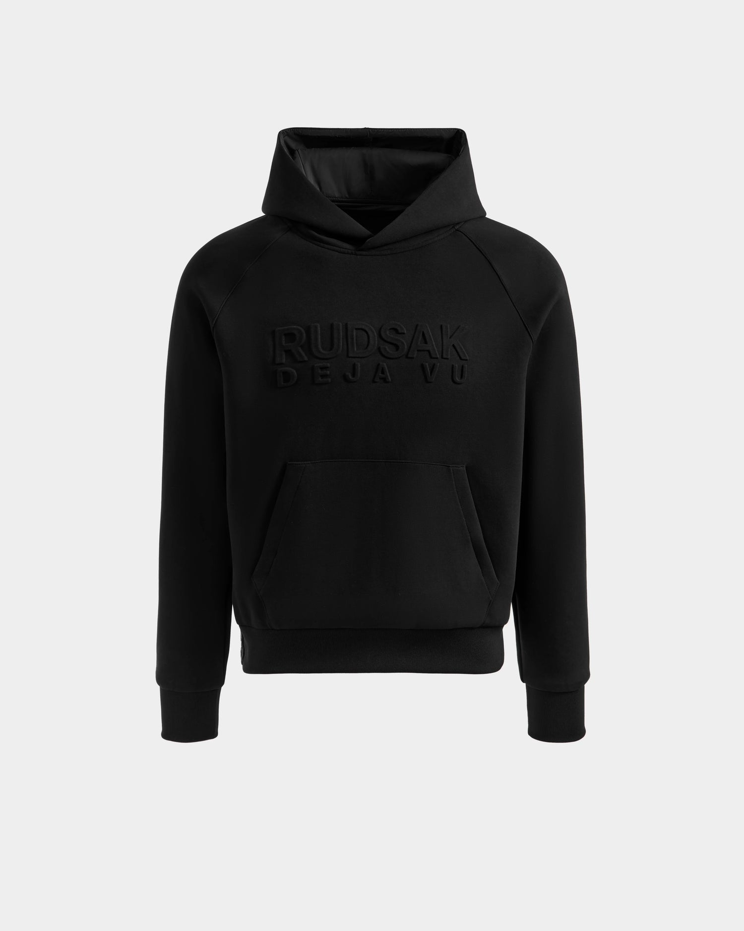 The Rudsak TREVIS - 6525599 Black hoodie features a front kangaroo pocket and embossed DEJA VUE text on the chest, shown against a plain light background.
