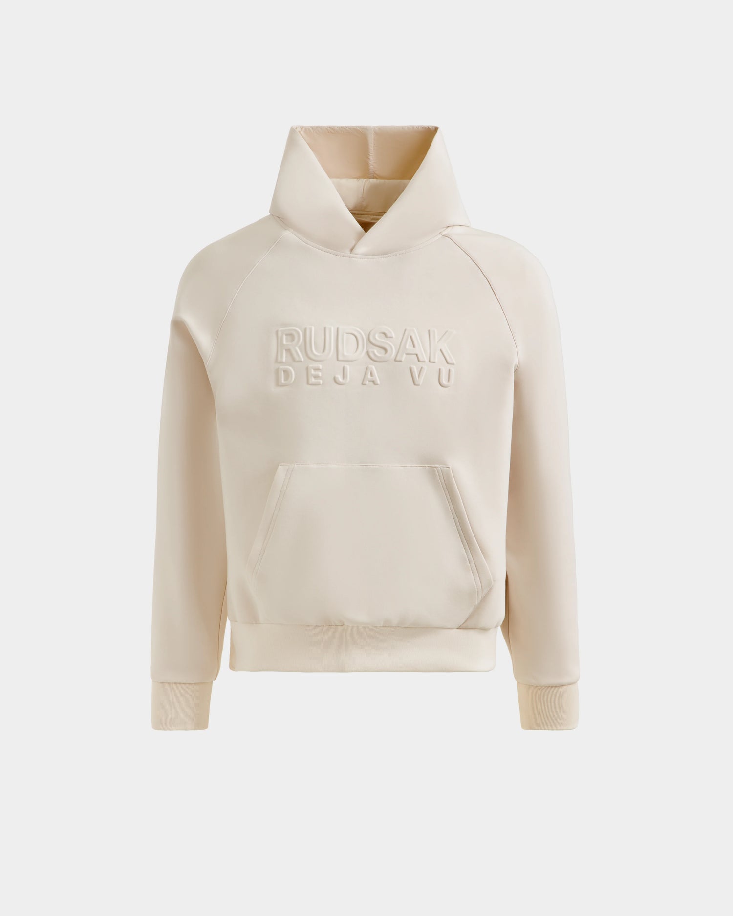 The Rudsak TREVIS - 6525599 Vanilla men's cotton-blend hoodie in beige features a front pocket, zippered side opening, and "RUDSAK DÉJÀ VU" embossed on the chest, shown against a plain white background.