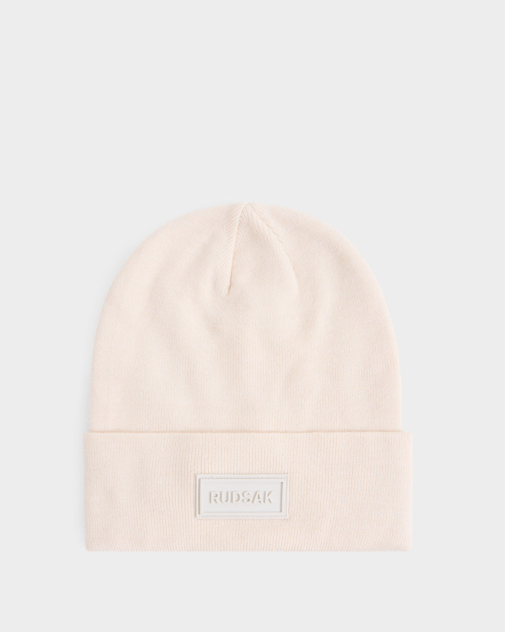 Cream-colored DILLION - U423501 Vanilla knit beanie by Rudsak with a folded cuff and a rectangular logo patch on the front.