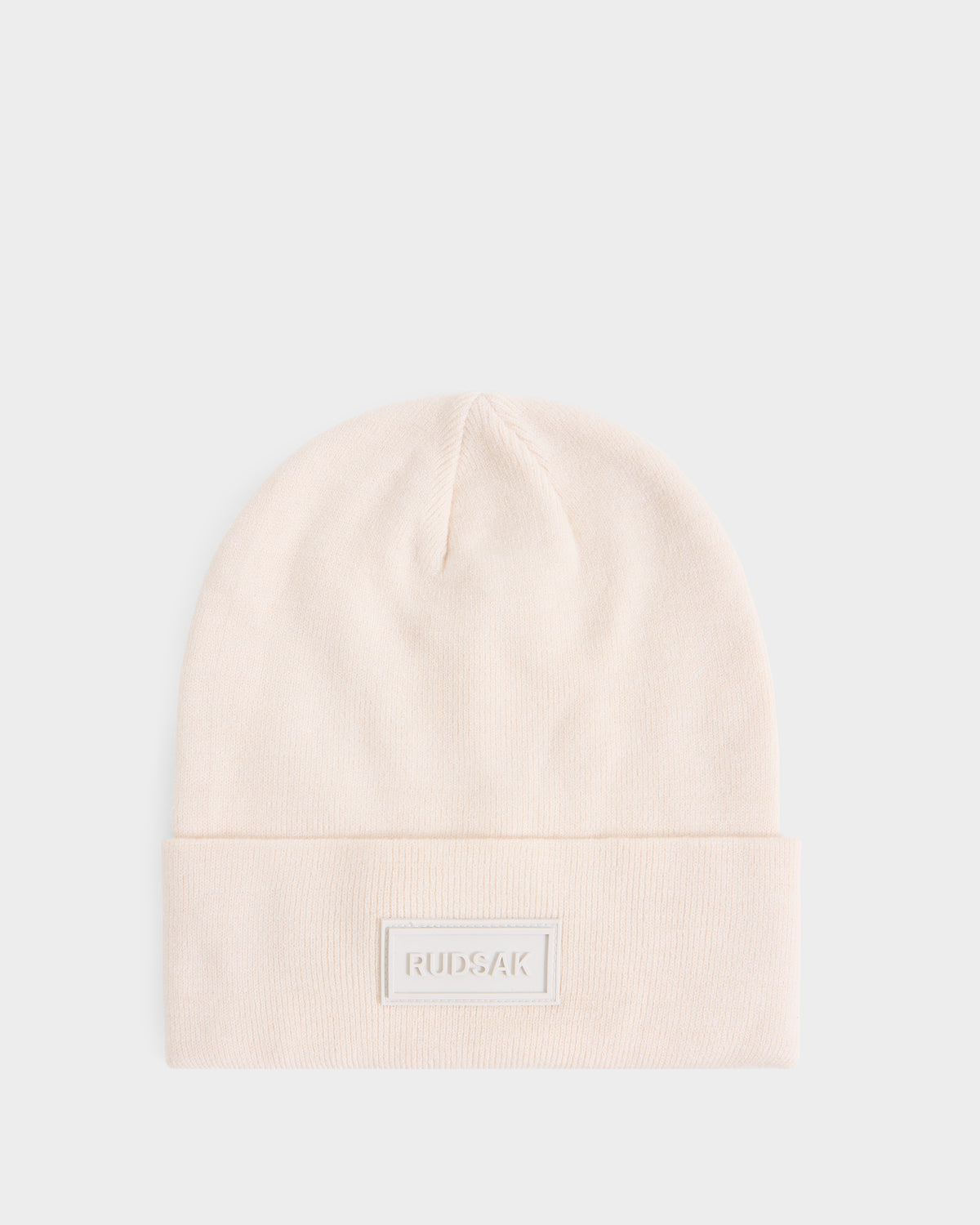 Cream-colored DILLION - U423501 Vanilla knit beanie by Rudsak with a folded cuff and a rectangular logo patch on the front.