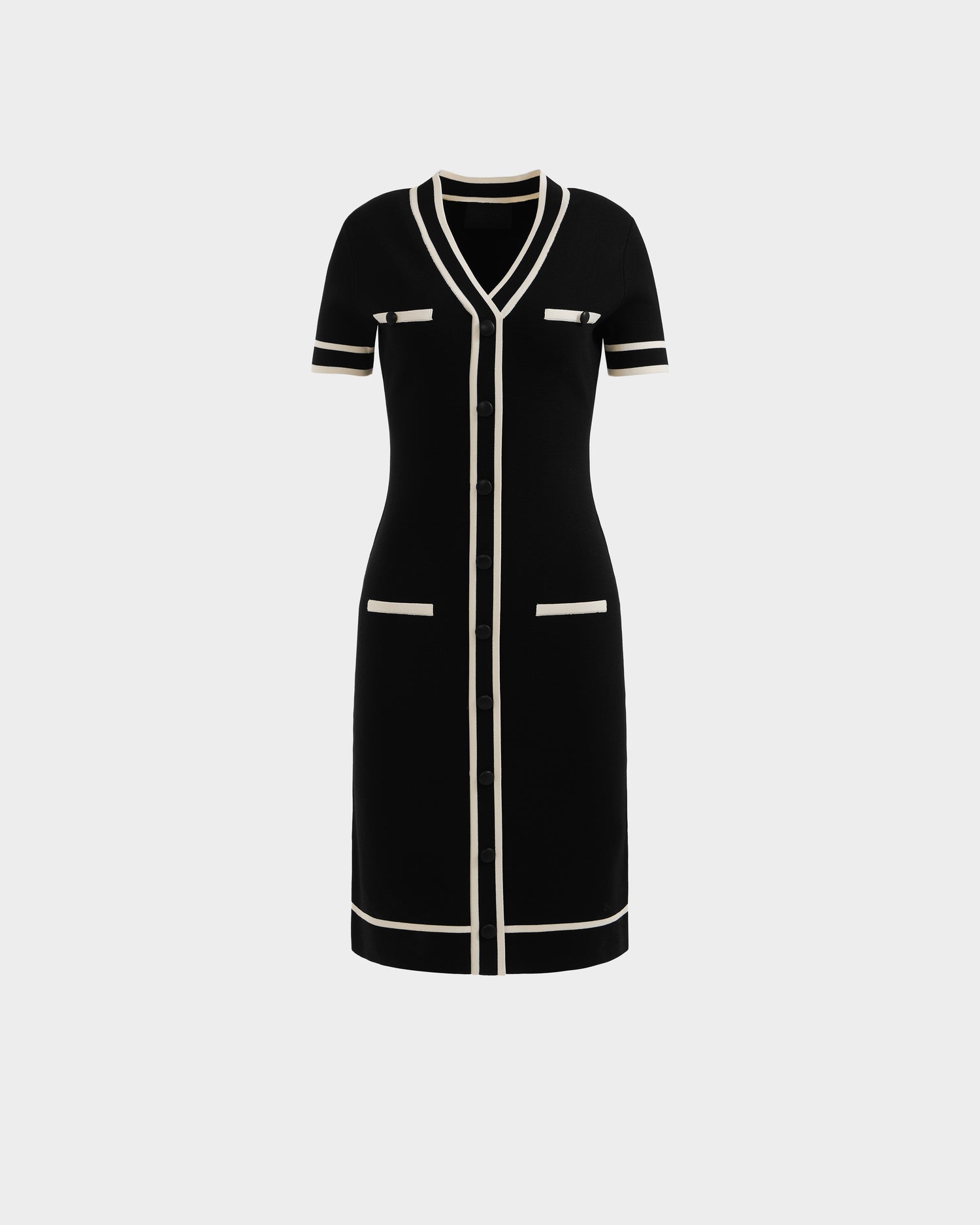 The VINNIE - 8526038 Black by Rudsak is a knee-length knit midi dress with a tailored V-neck, white trim, button-down front, short sleeves, and four pockets for both style and functionality.