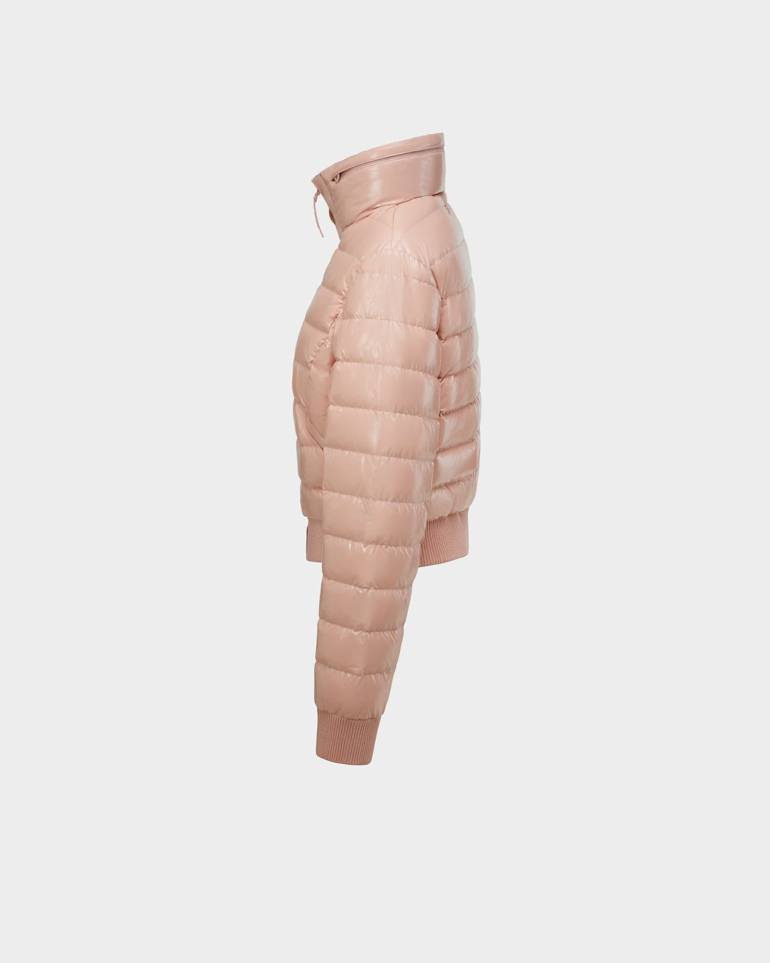 The Rudsak SOLENE - L124002 Soft Pink is a womens fitted down puffer with a high collar and ribbed cuffs, shown from the side against a white background—ideal for adding lightweight warmth to your spring wardrobe.