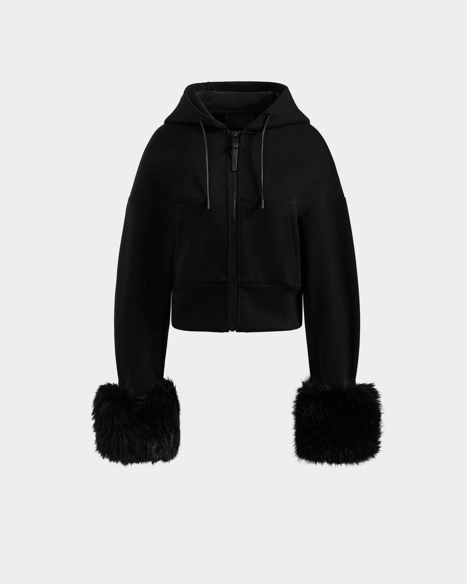 The ZILLIA - 8525673 Black by Rudsak is a women's cropped zip-up hoodie with a front zipper, drawstrings, and large faux fur wrist cuffs on the sleeves.