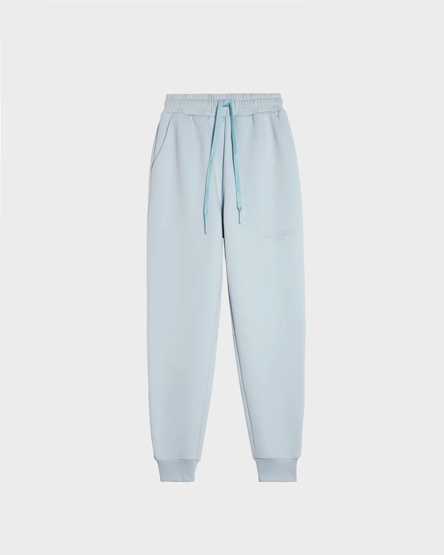 JOSS - 9524009 Sky Blue W premium cotton joggers feature an elastic waistband, drawstring, side pockets, and ribbed cuffs. Shown on a white background, these unisex joggers combine comfort, style, and versatility for any wardrobe.