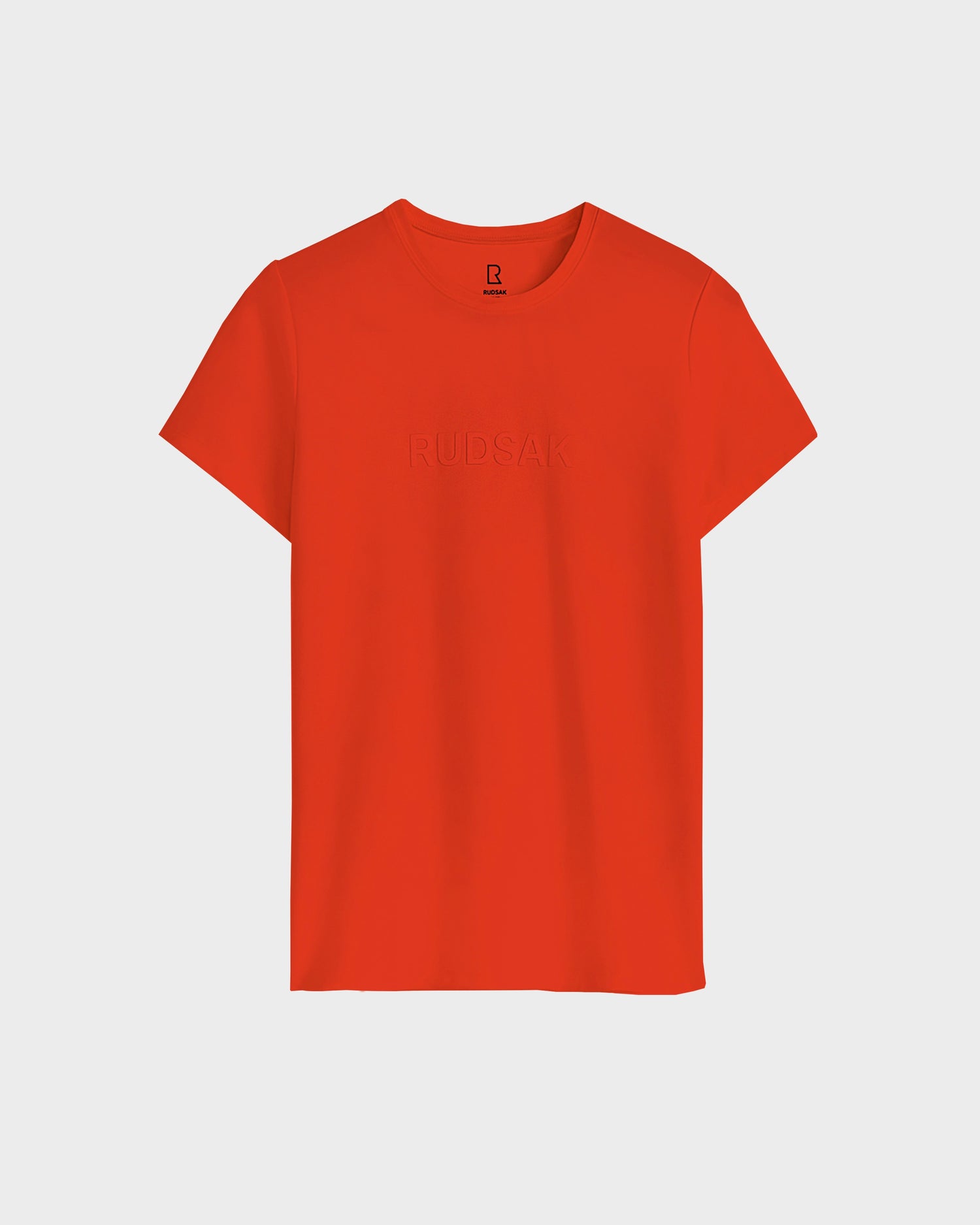 The TIFFANY - 8523048 ORANGE women's T-shirt by Rudsak features short sleeves and subtle "RUDSAK" embossing on the front, shown against a plain white background.