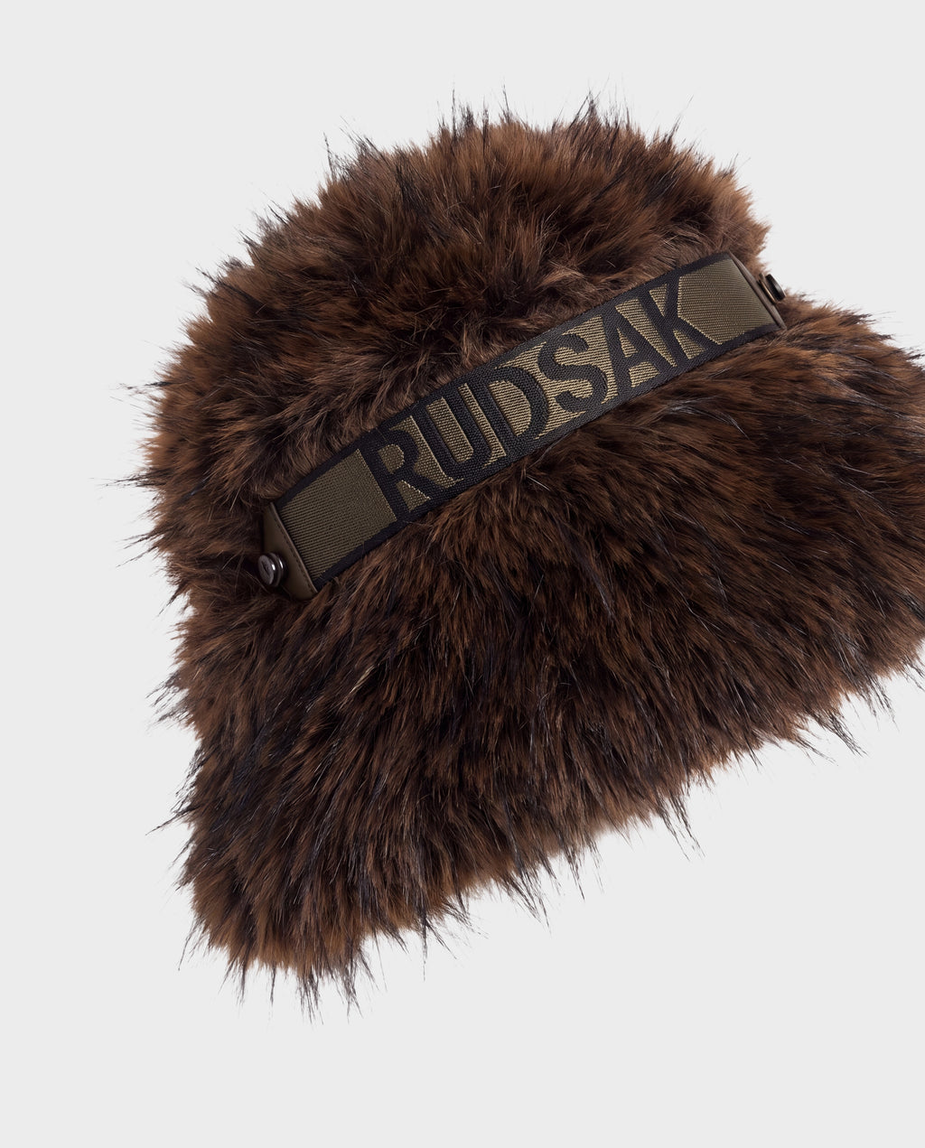 ROMINA - 8425545 Mix Espresso cozy-luxe brown faux fur bucket hat with an olive green strap across the front featuring the Rudsak brand name in black lettering.