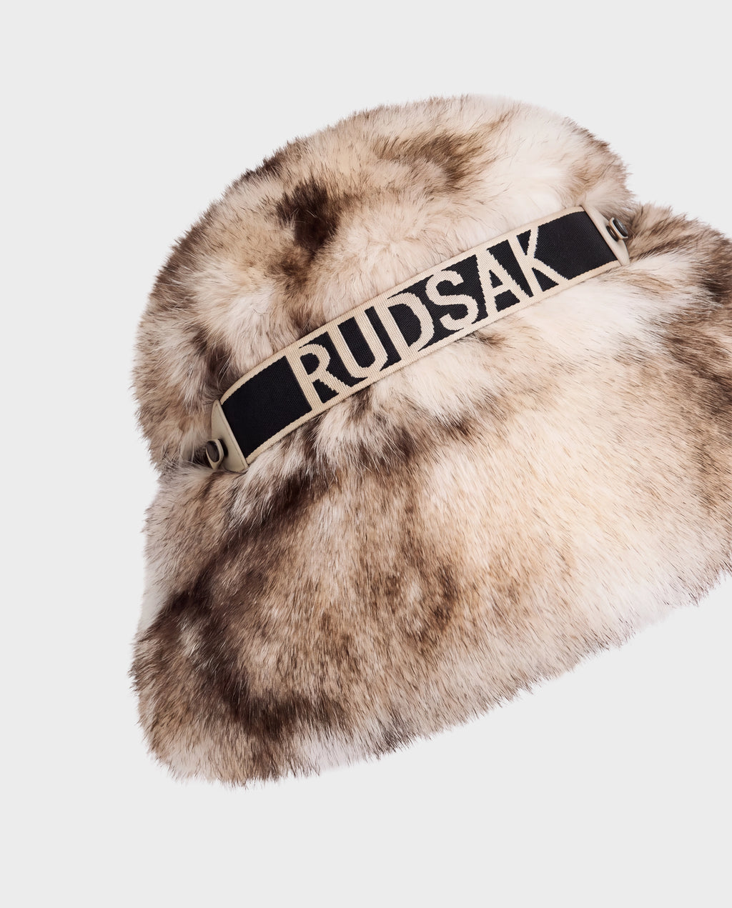 Vanilla-toned ROMINA - 8425545 Mix Vanilla faux fur bucket hat featuring a black elastic band across the front with the Rudsak brand name in white lettering.