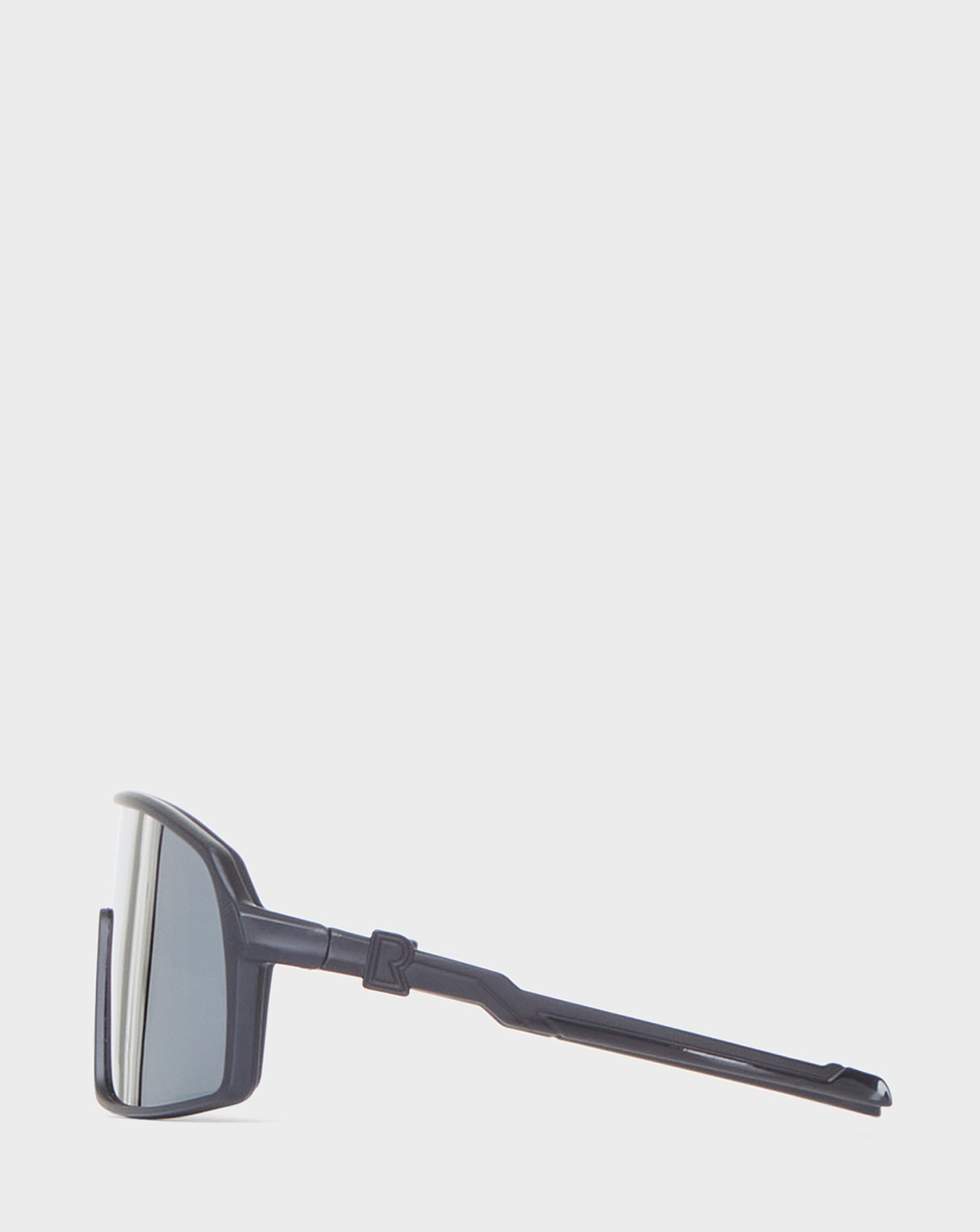 A pair of Rudsak AKSEL - 9422031 BLACK METALLIC sunglasses with UV Block Lenses and a reflective finish shown from the side, resting on a white background.