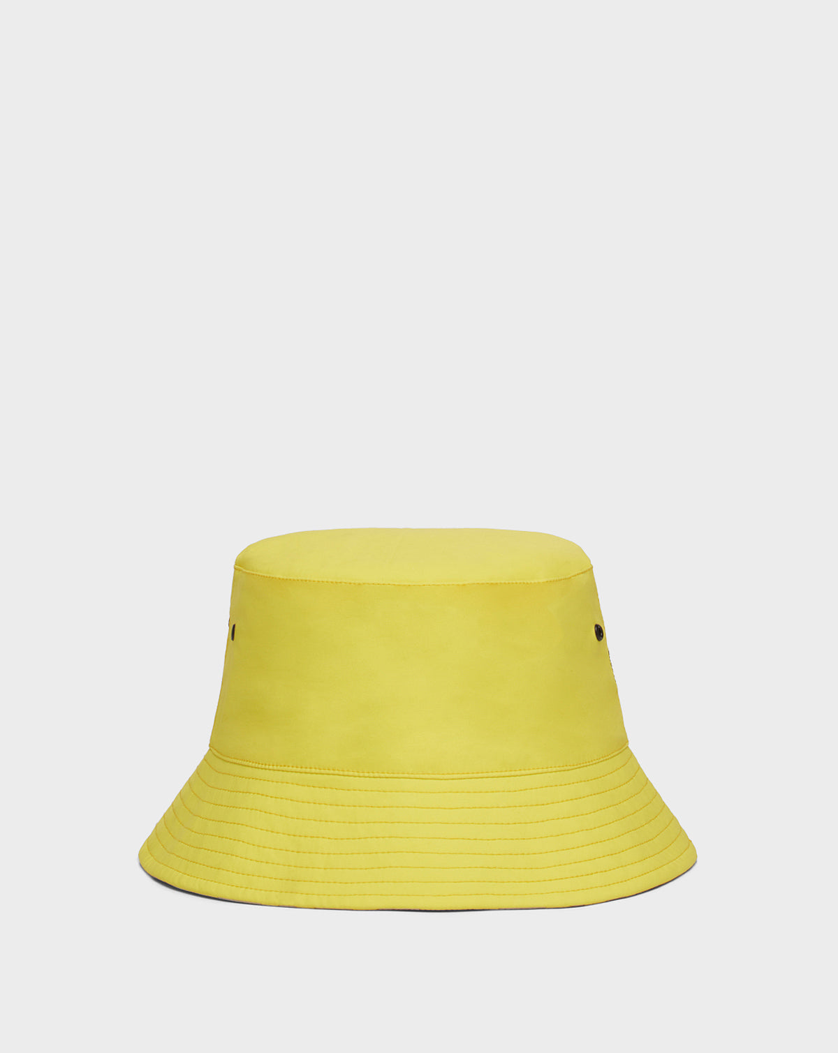 The AYLA - 9422004 YELLOW by Rudsak is a bright yellow unisex reversible bucket hat with visible stitching and two small side eyelets, shown against a plain white background. Both stylish and versatile, it's perfect for any look.
